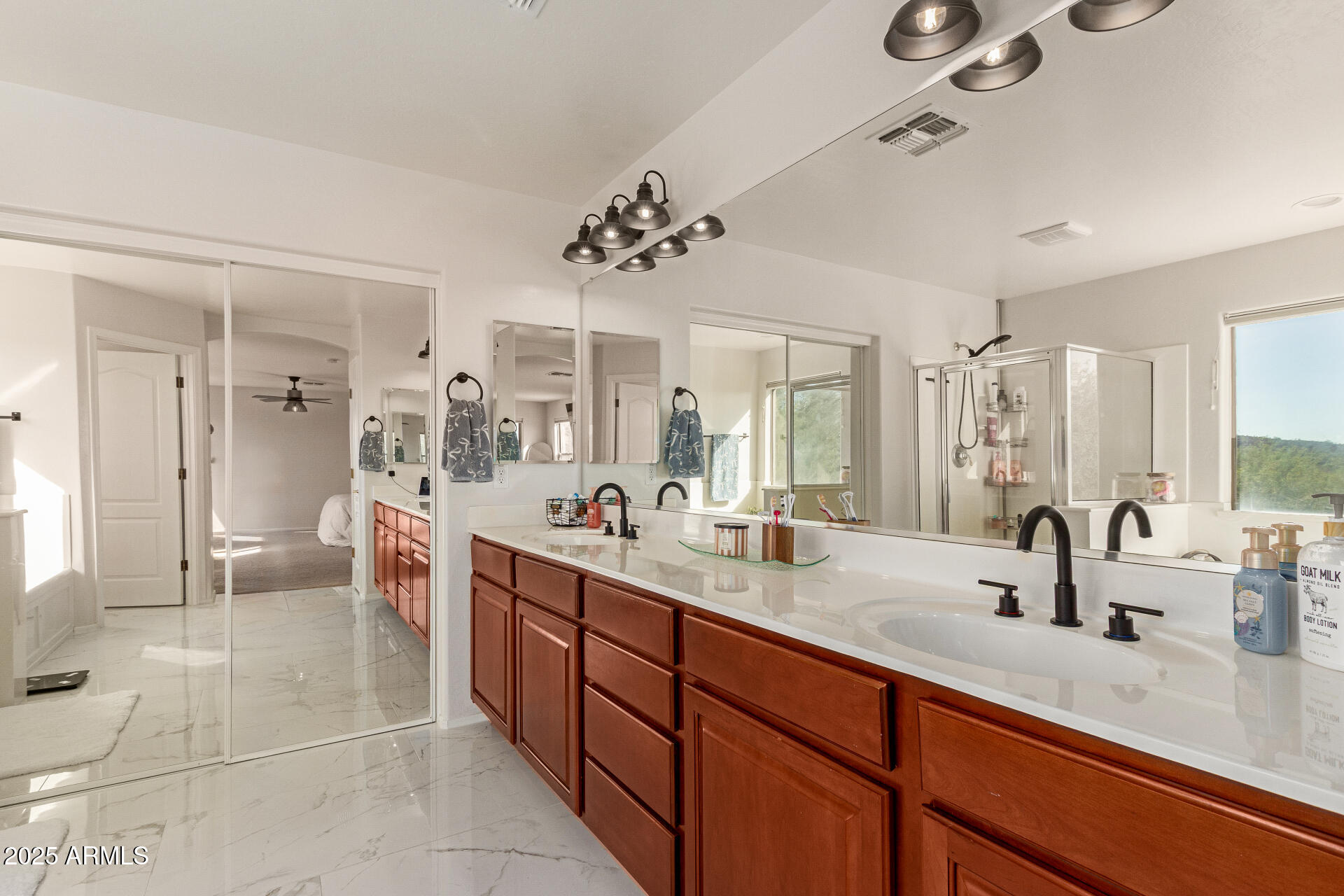 6003 West Oberlin Way Phoenix, AZ 85083 - Photo 23 of 69 a large bathroom with a double vanity sink mirror and shower