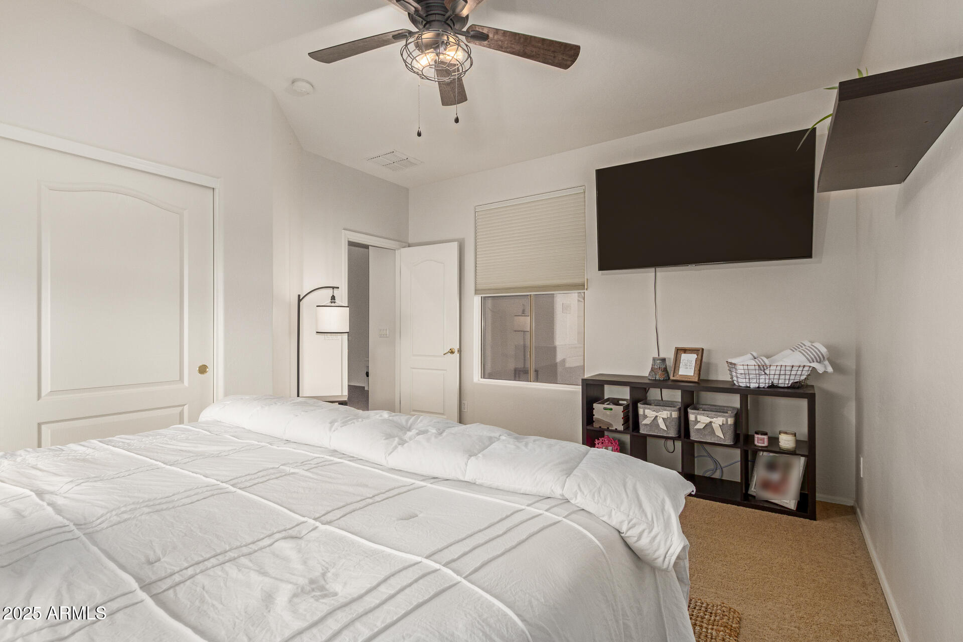 6003 West Oberlin Way Phoenix, AZ 85083 - Photo 28 of 69 a bedroom with a bed and a flat screen tv