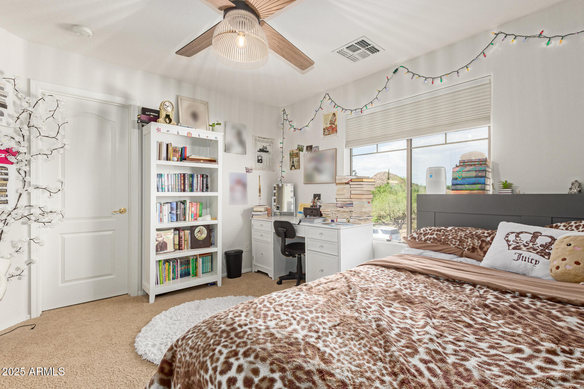 6003 West Oberlin Way Phoenix, AZ 85083 - Photo 35 of 69 a bedroom with a large bed and a book shelf