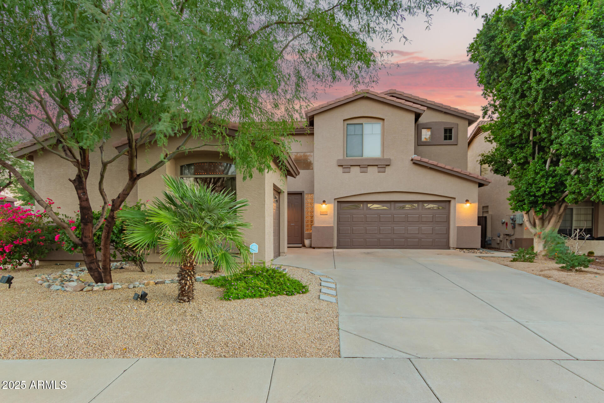 6003 West Oberlin Way Phoenix, AZ 85083 - Photo 4 of 69 a front view of a house with a yard and garage