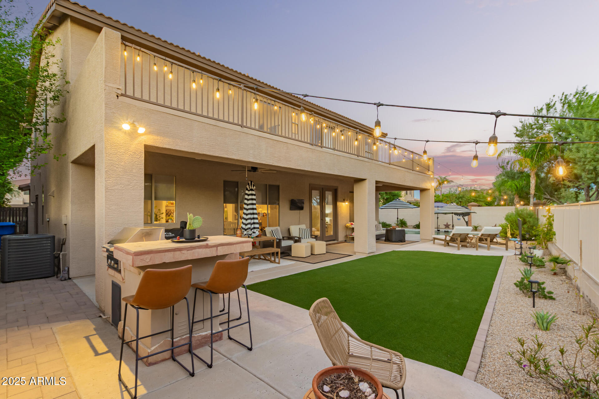 6003 West Oberlin Way Phoenix, AZ 85083 - Photo 45 of 69 a view of a patio with couches dining table and chairs with garden view