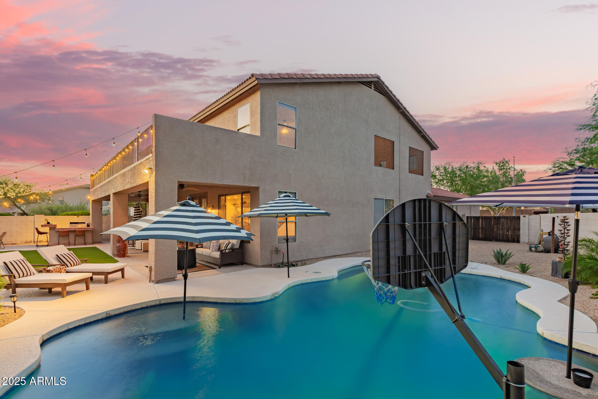 6003 West Oberlin Way Phoenix, AZ 85083 - Photo 47 of 69 a front view of a house with garden water slide and outdoor seating