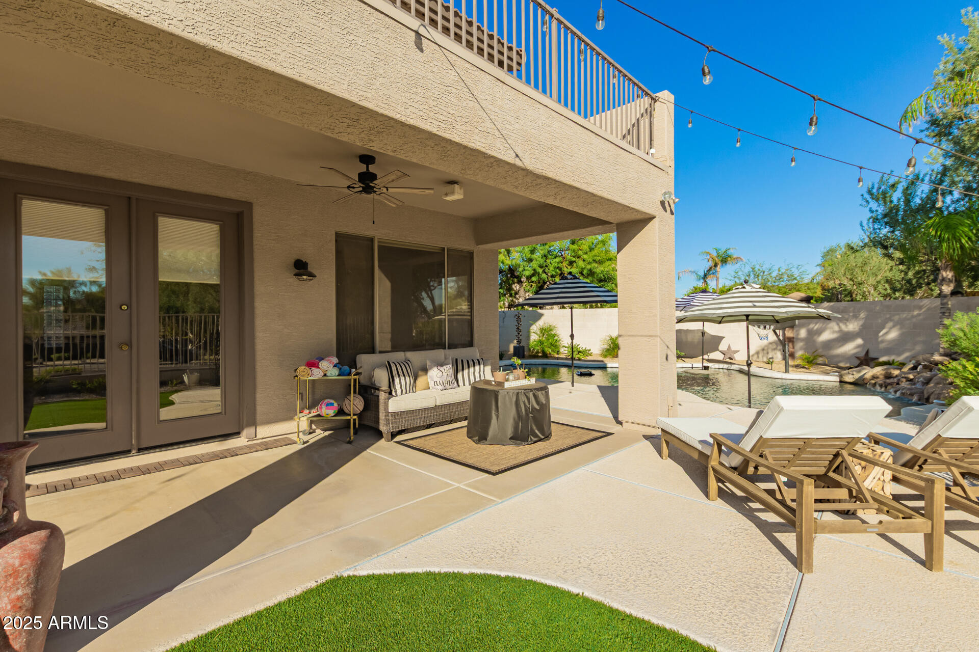 6003 West Oberlin Way Phoenix, AZ 85083 - Photo 52 of 69 a bedroom with furniture and a potted plant