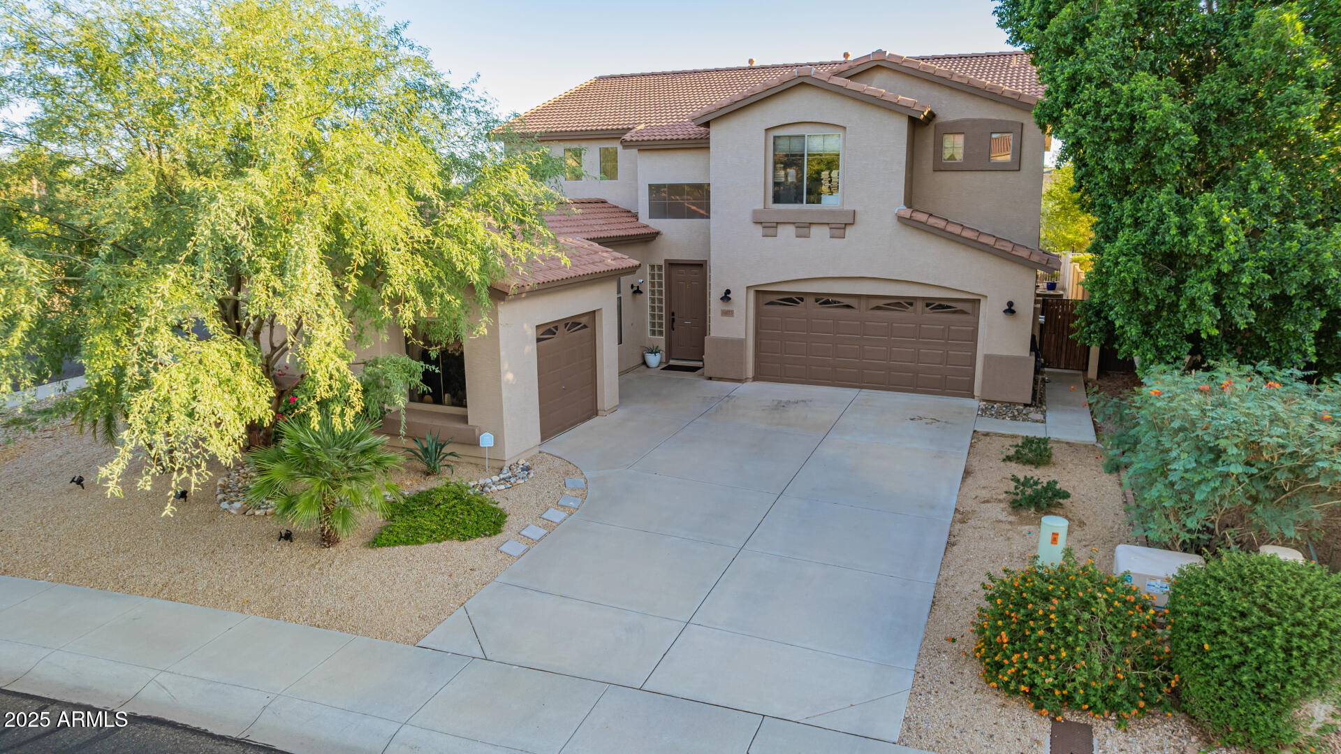 6003 West Oberlin Way Phoenix, AZ 85083 - Photo 59 of 69 a front view of a house with a garden