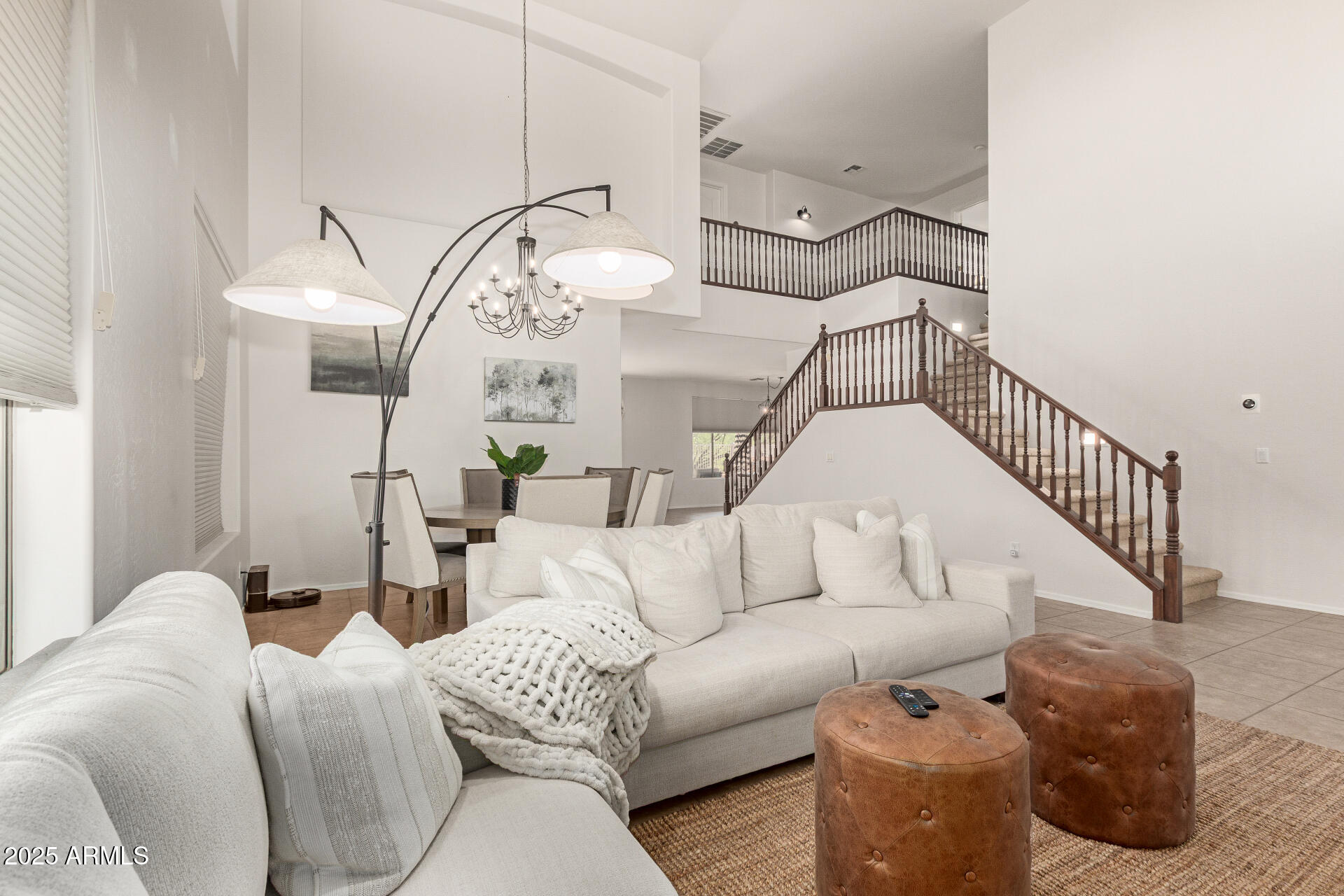 6003 West Oberlin Way Phoenix, AZ 85083 - Photo 6 of 69 a living room with furniture and a chandelier