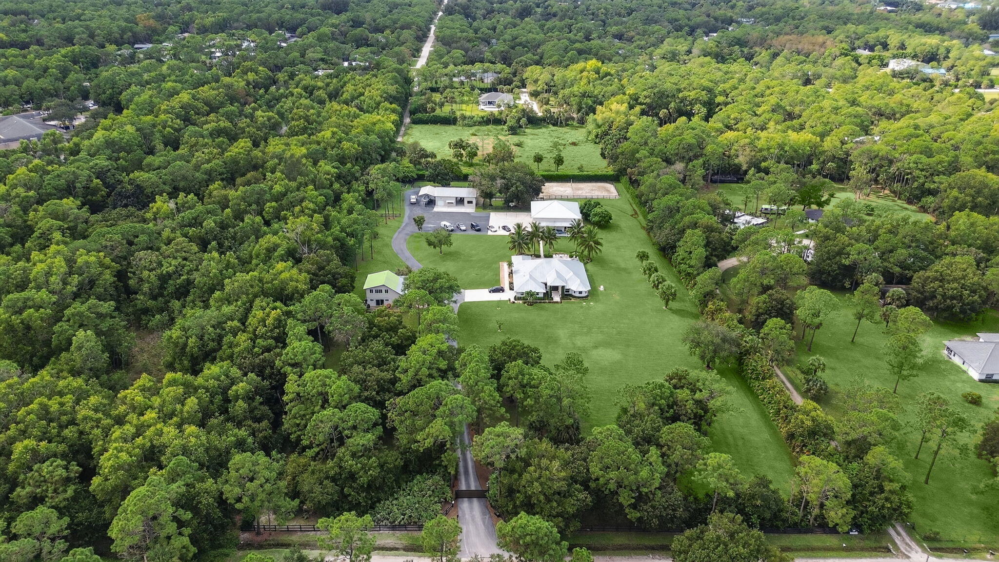 17593 Winterhawk Trail Jupiter, FL 33478 - Photo 11 of 49 a view of a house with a lush green forest