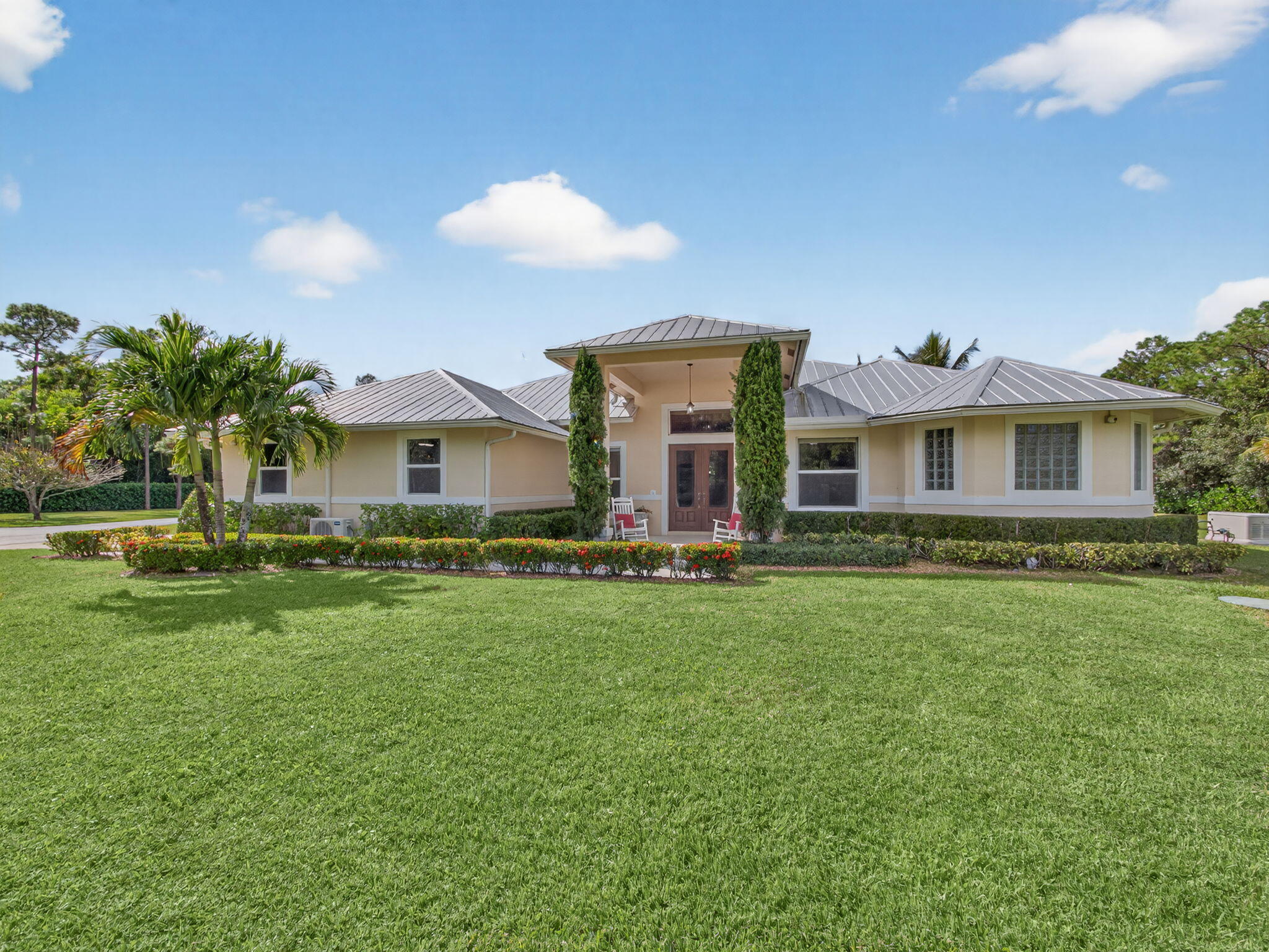 17593 Winterhawk Trail Jupiter, FL 33478 - Photo 13 of 49 a front view of a house with a yard