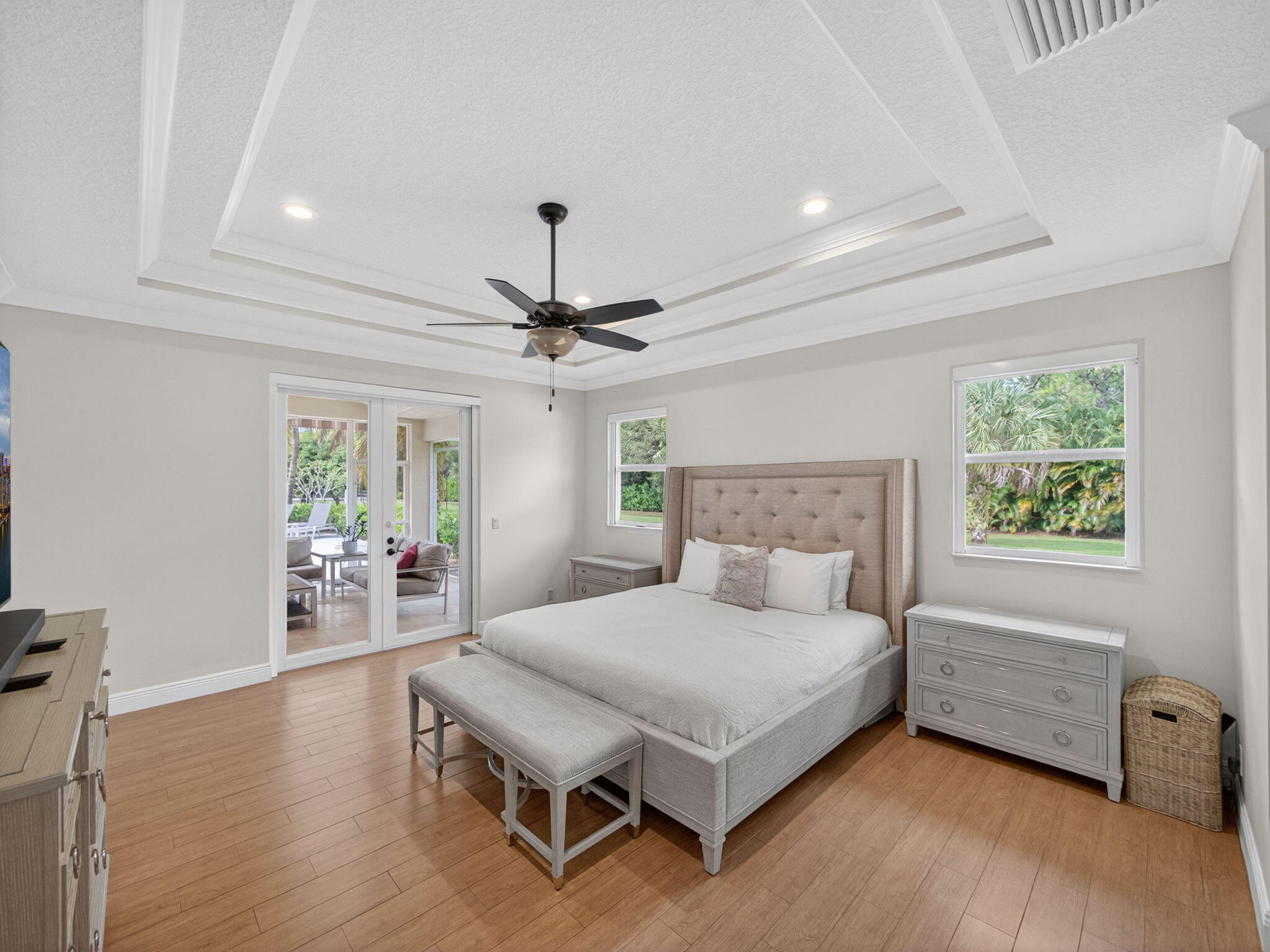 17593 Winterhawk Trail Jupiter, FL 33478 - Photo 19 of 49 a bedroom with a bed and a table