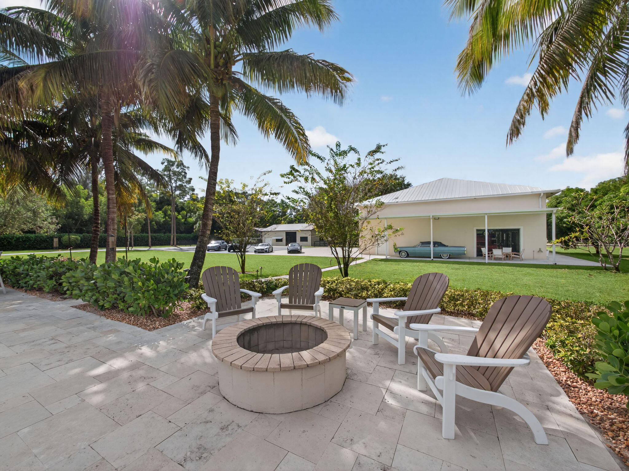 17593 Winterhawk Trail Jupiter, FL 33478 - Photo 25 of 49 a view of a patio with couches chair and a fire pit