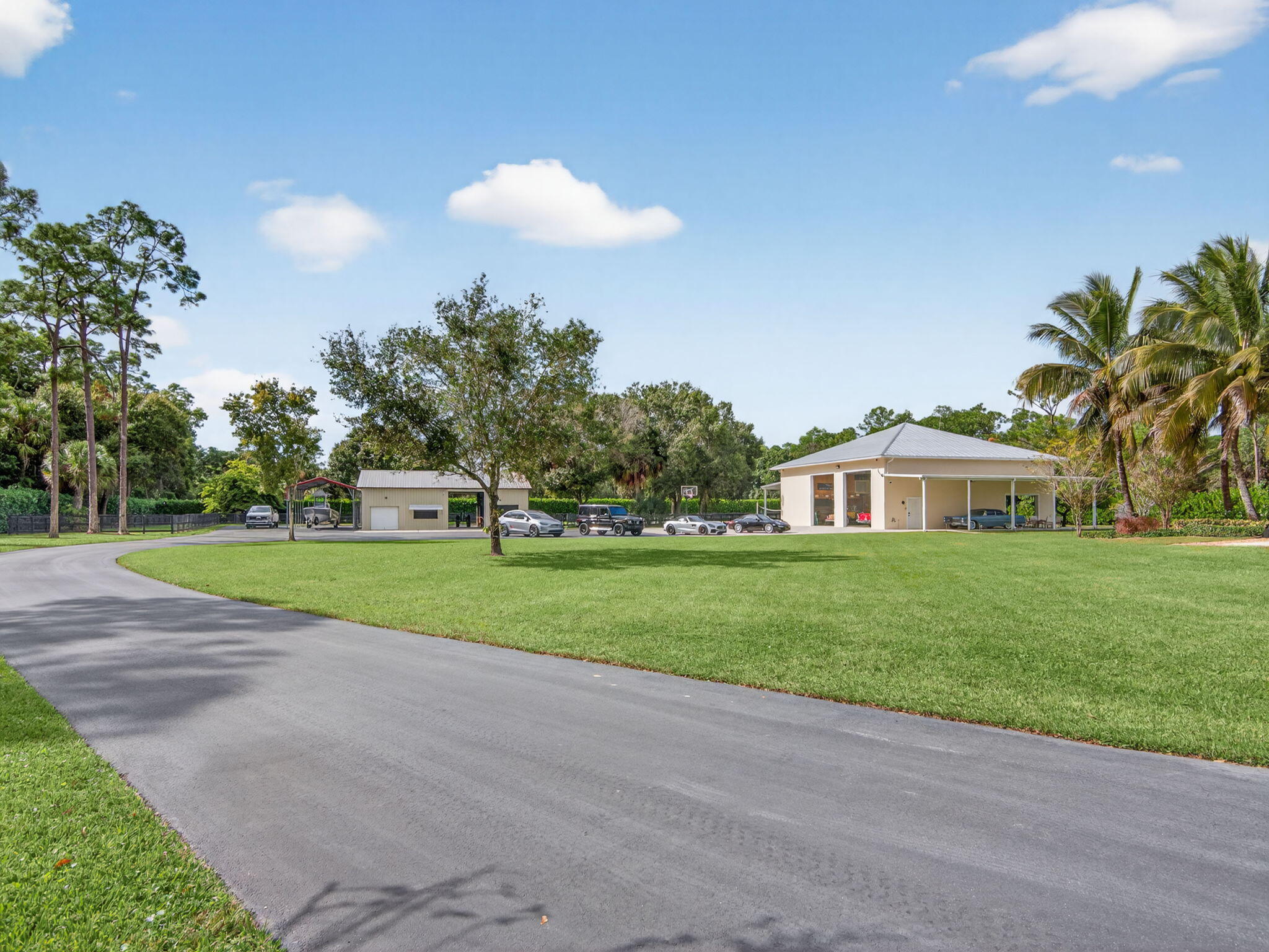 17593 Winterhawk Trail Jupiter, FL 33478 - Photo 26 of 49 a view of a house with a big yard and large trees