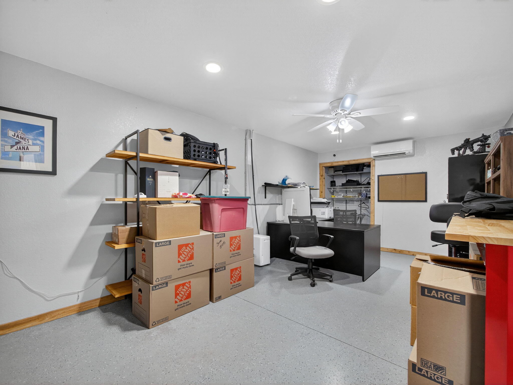 17593 Winterhawk Trail Jupiter, FL 33478 - Photo 34 of 49 a bedroom with furniture and a flat screen tv