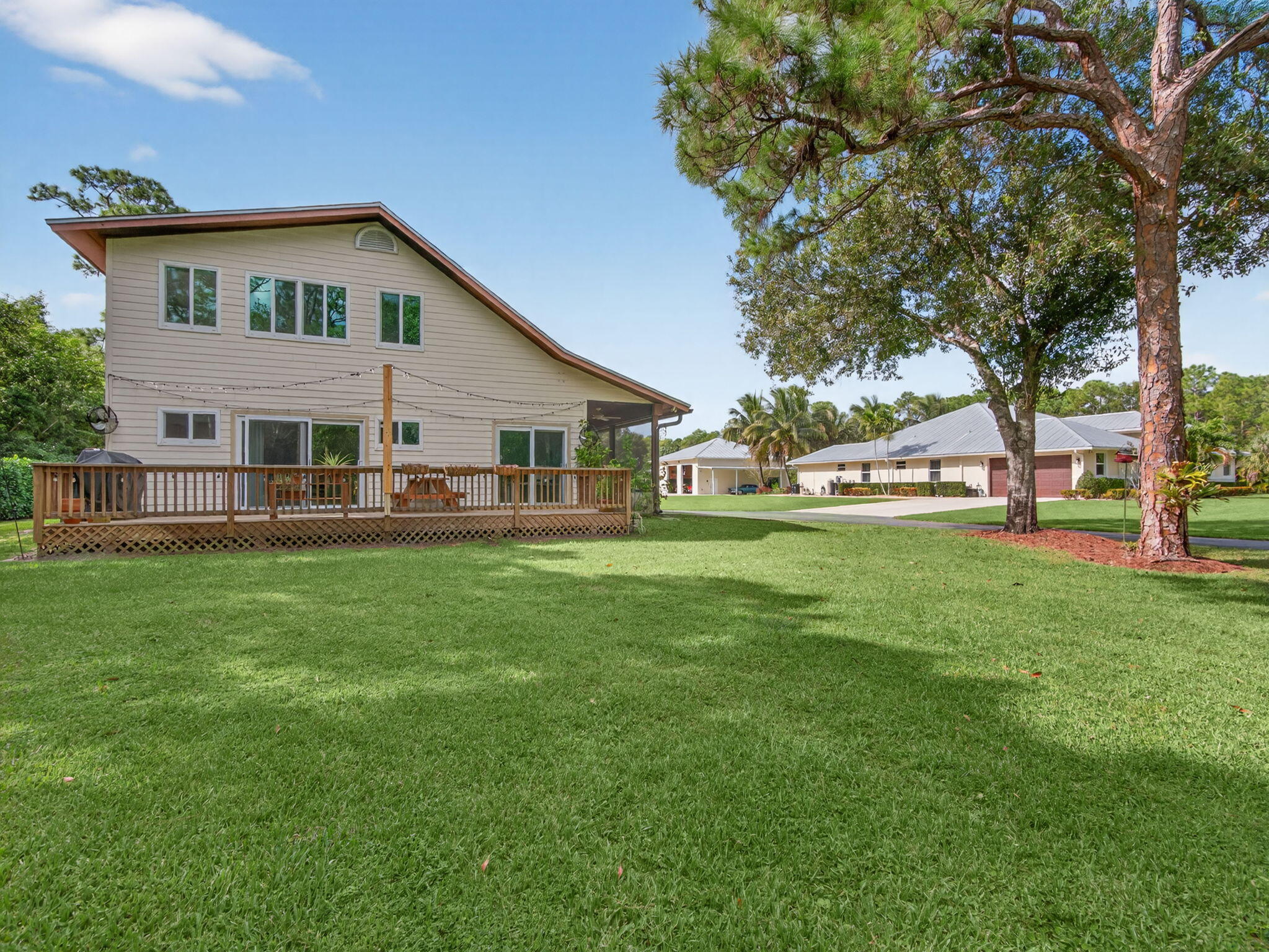 17593 Winterhawk Trail Jupiter, FL 33478 - Photo 36 of 49 a front view of house with yard and outdoor seating