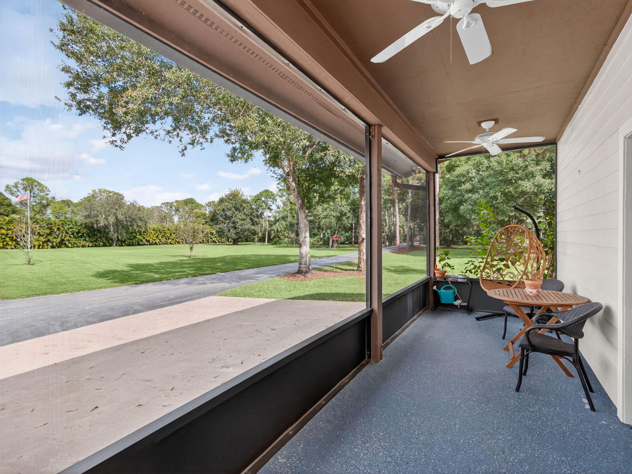 17593 Winterhawk Trail Jupiter, FL 33478 - Photo 40 of 49 a swimming pool with outdoor seating and a garden