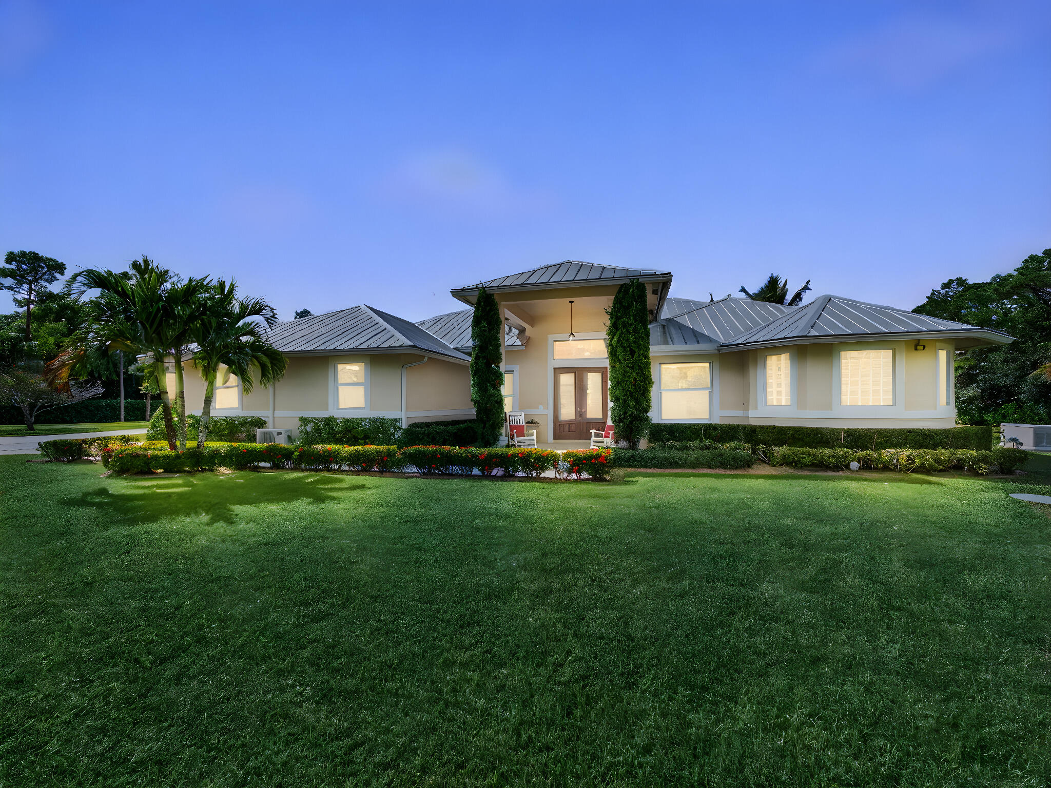 17593 Winterhawk Trail Jupiter, FL 33478 - Photo 49 of 49 a front view of a house with a garden and yard