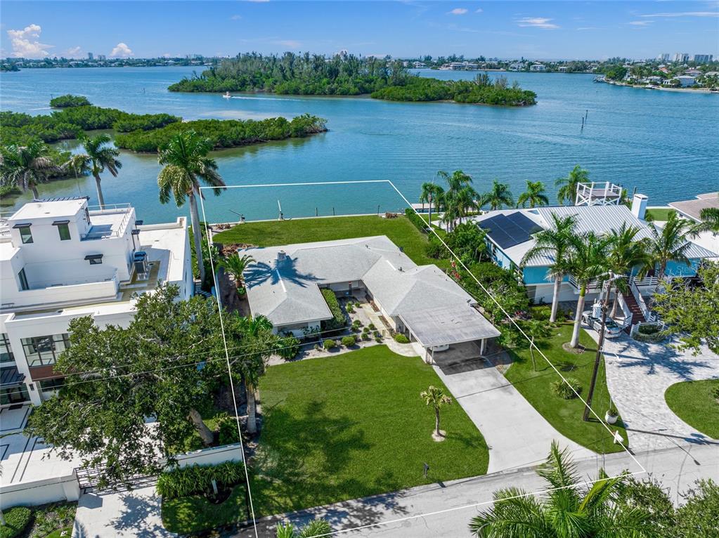 1386 Tangier Way Sarasota, FL 34239 - Photo 19 of 26 an aerial view of a house with outdoor space and lake view