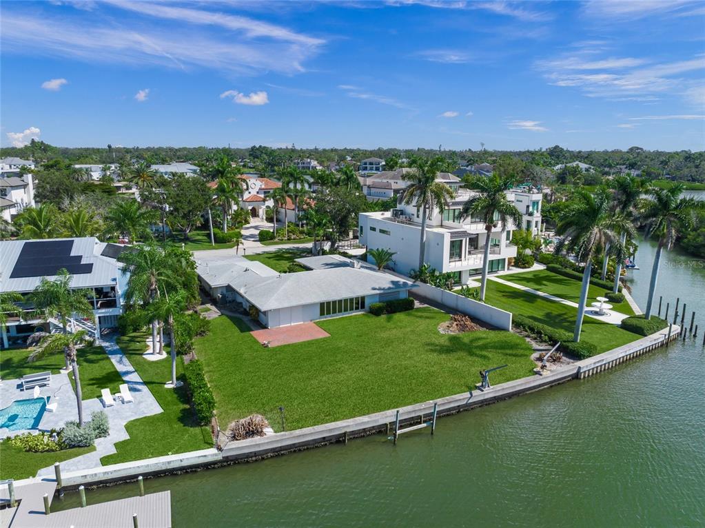 1386 Tangier Way Sarasota, FL 34239 - Photo 20 of 26 an aerial view of residential houses with outdoor space and trees