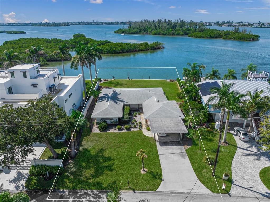 1386 Tangier Way Sarasota, FL 34239 - Photo 3 of 26 an aerial view of a house with garden space and a patio