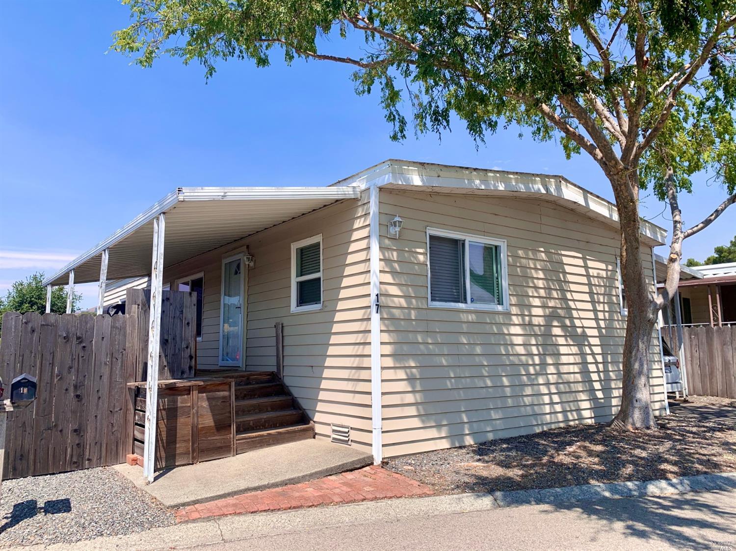 17 Yosemite Road, Unit 17 San Rafael, CA 94903 - Photo 1 of 1 a front view of a house with a tree