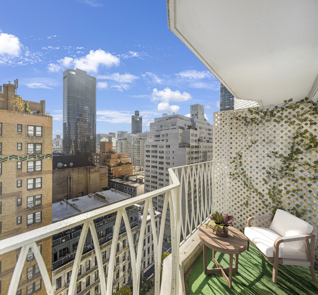 a view of a balcony with two chairs and a table