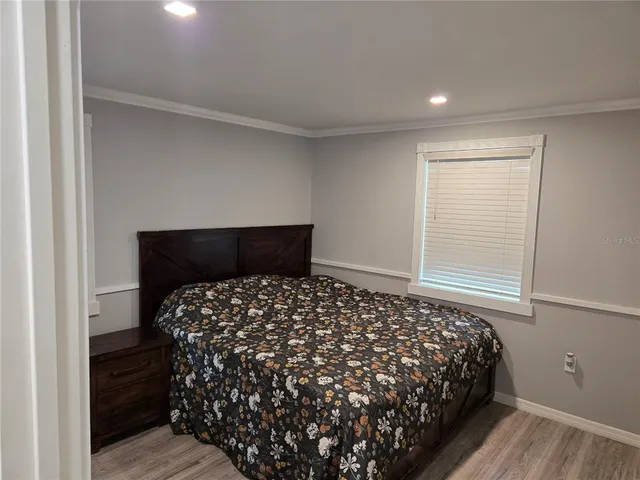 a bedroom with bed and window