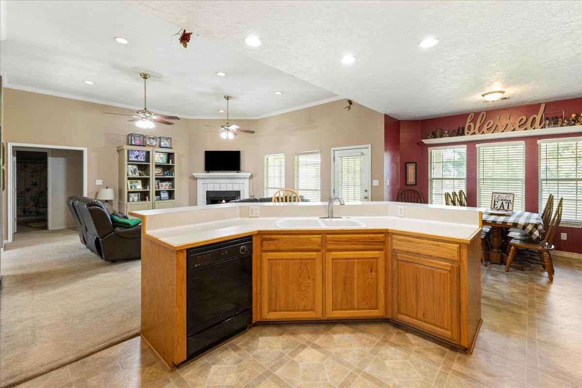 544 Meadow Lane Winnie, TX 77665 - Photo 17 of 38 a large kitchen with kitchen island a sink a center island and a stove