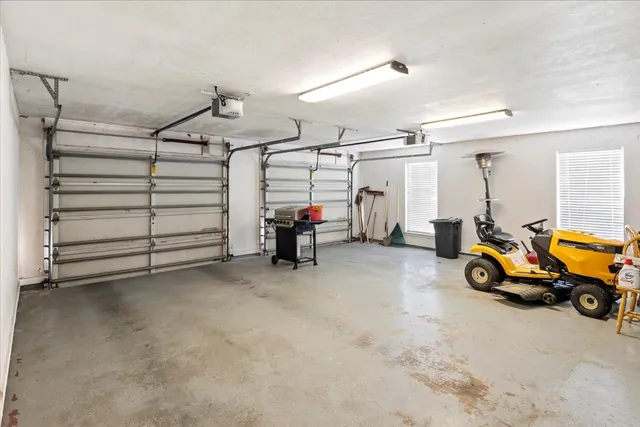 a view of a garage with parked cars