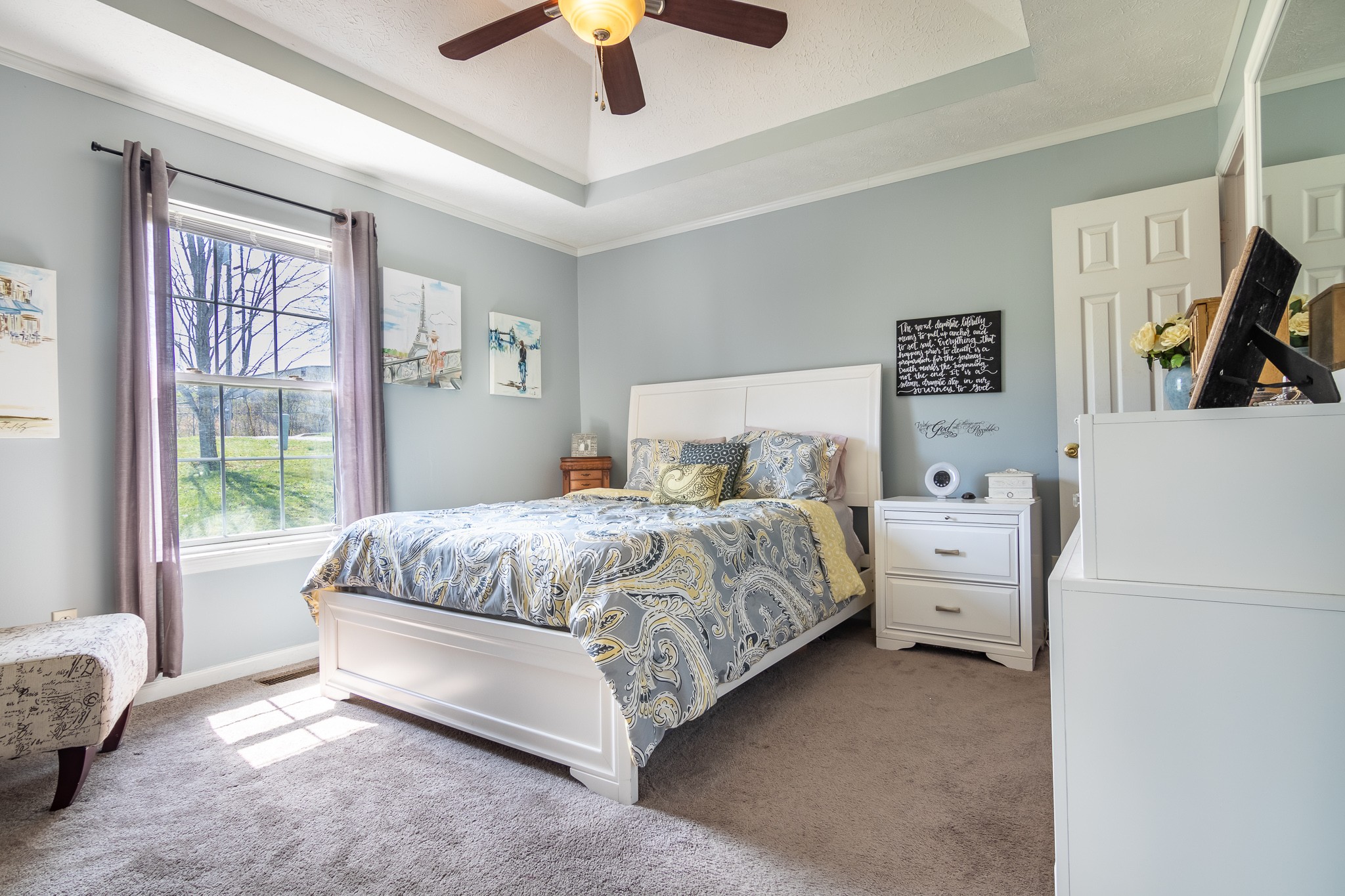 105 Elder Drive Springfield, TN 37172 - Photo 9 of 15 a bedroom with a bed and a chandelier