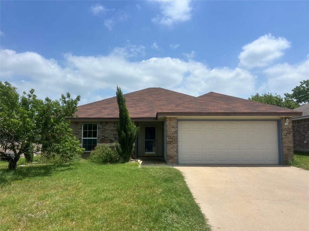 a front view of house with yard