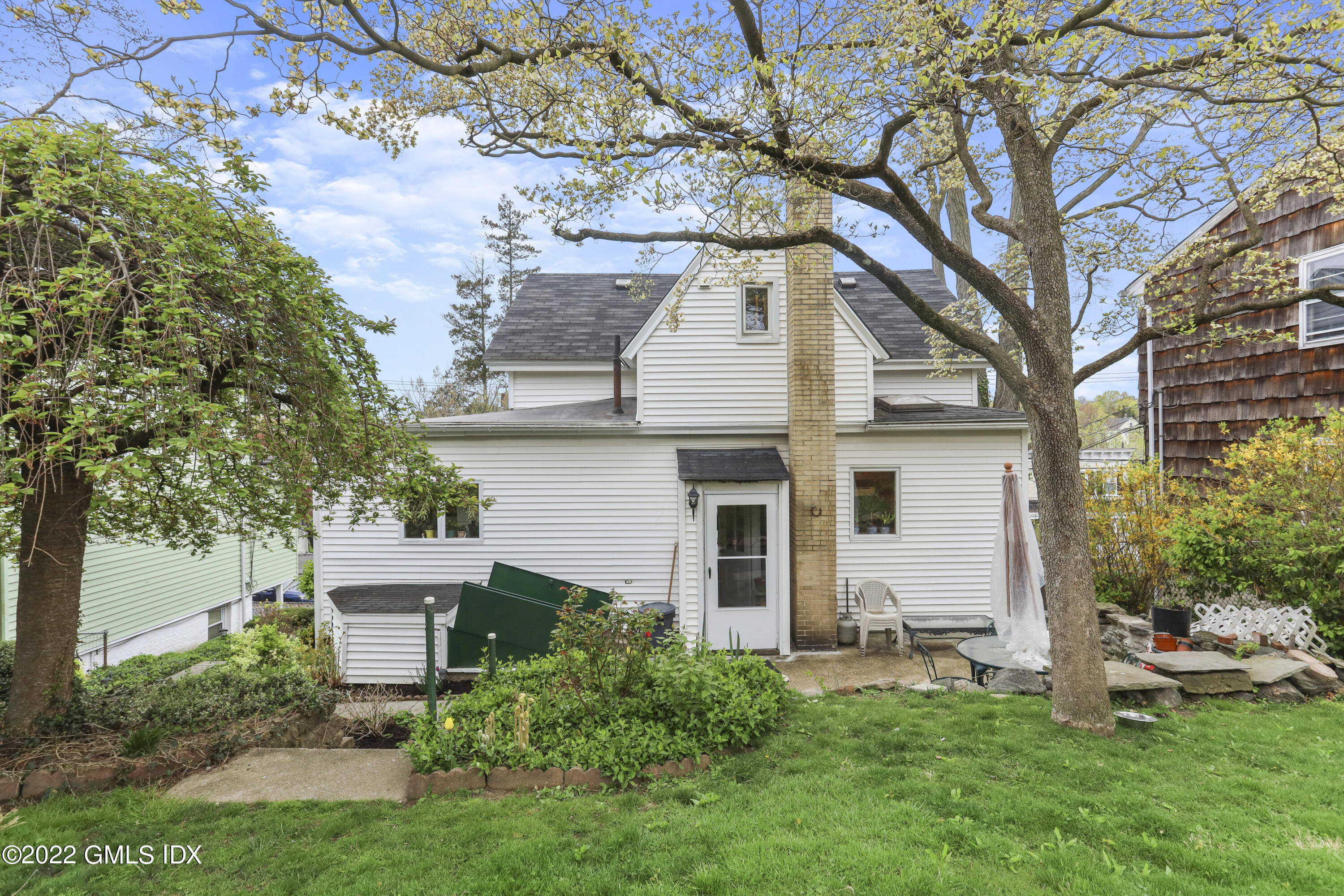 119 North Water Street Greenwich, CT 06830 - Photo 11 of 15 a white house that has a tree in front of it