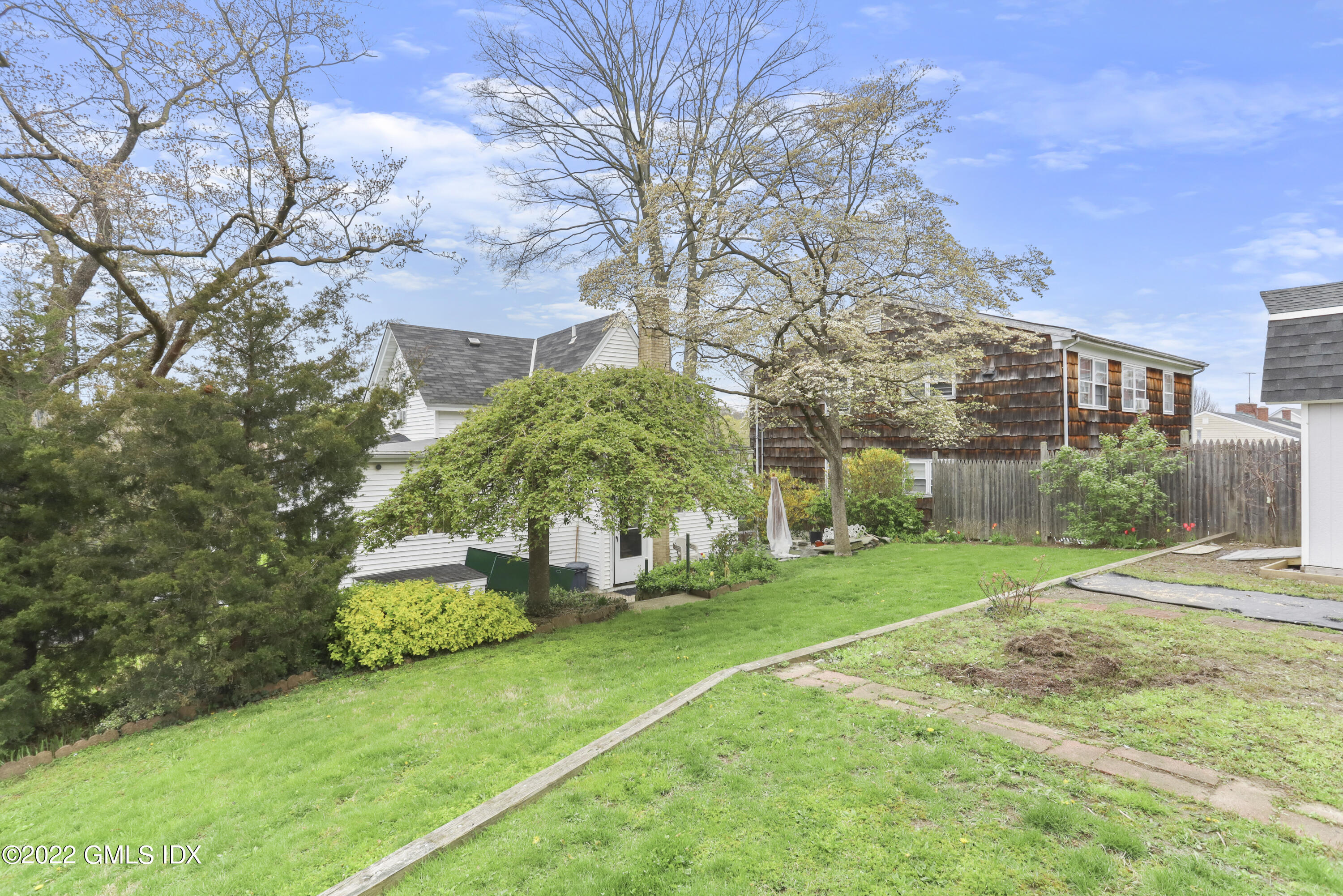 119 North Water Street Greenwich, CT 06830 - Photo 12 of 15 a front view of a house with garden