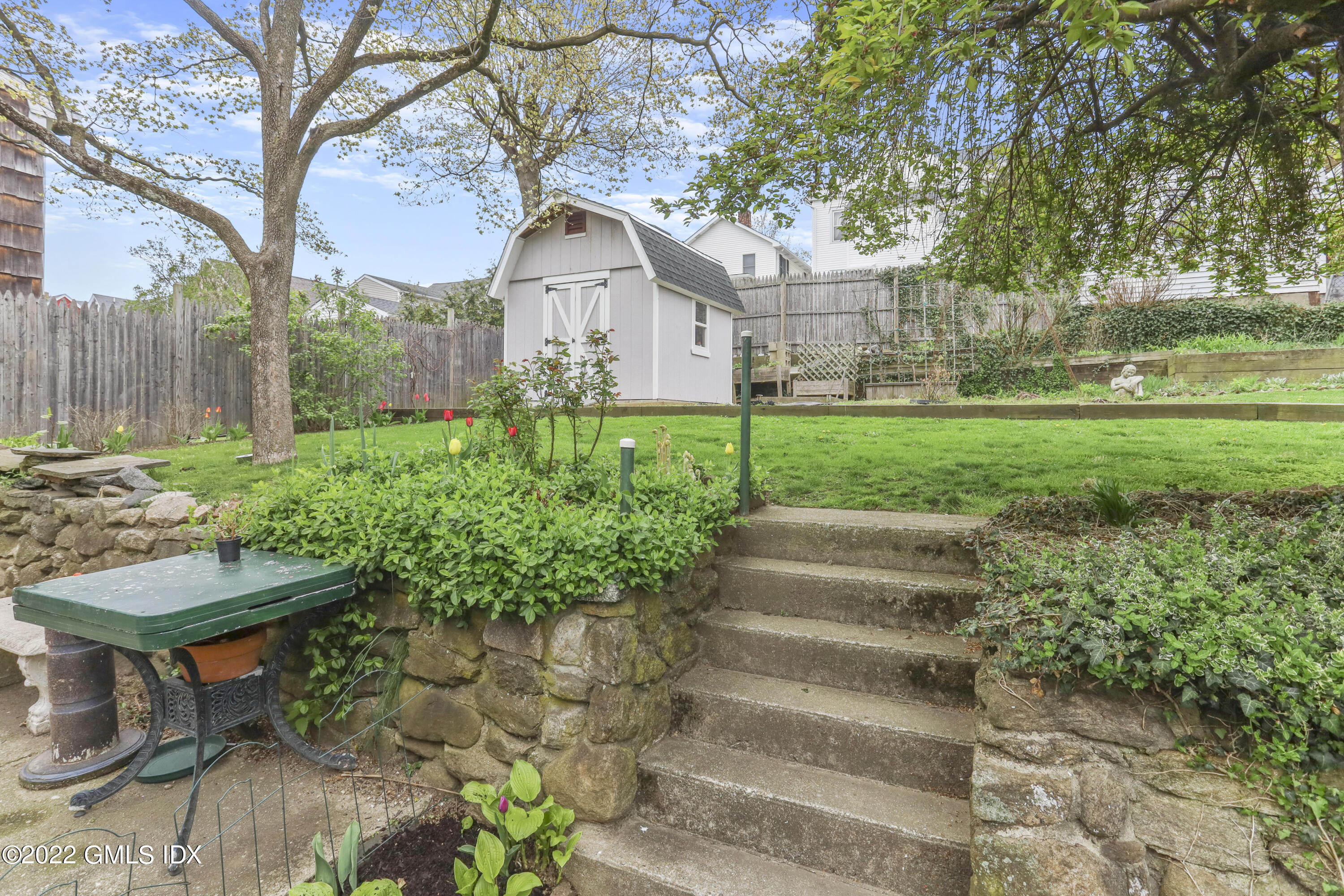 119 North Water Street Greenwich, CT 06830 - Photo 13 of 15 a view of a house with yard and sitting area
