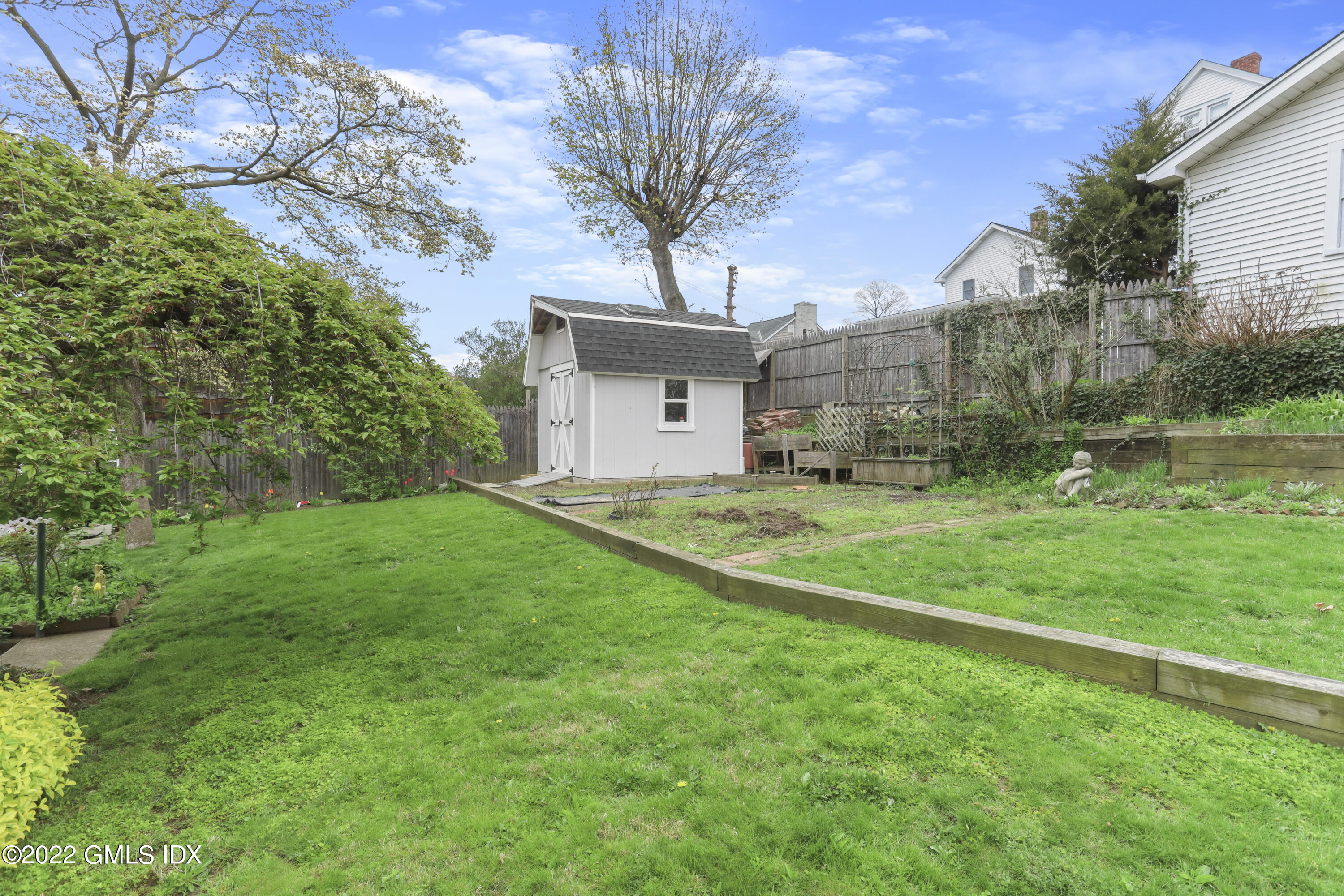 119 North Water Street Greenwich, CT 06830 - Photo 14 of 15 a view of a house with a yard