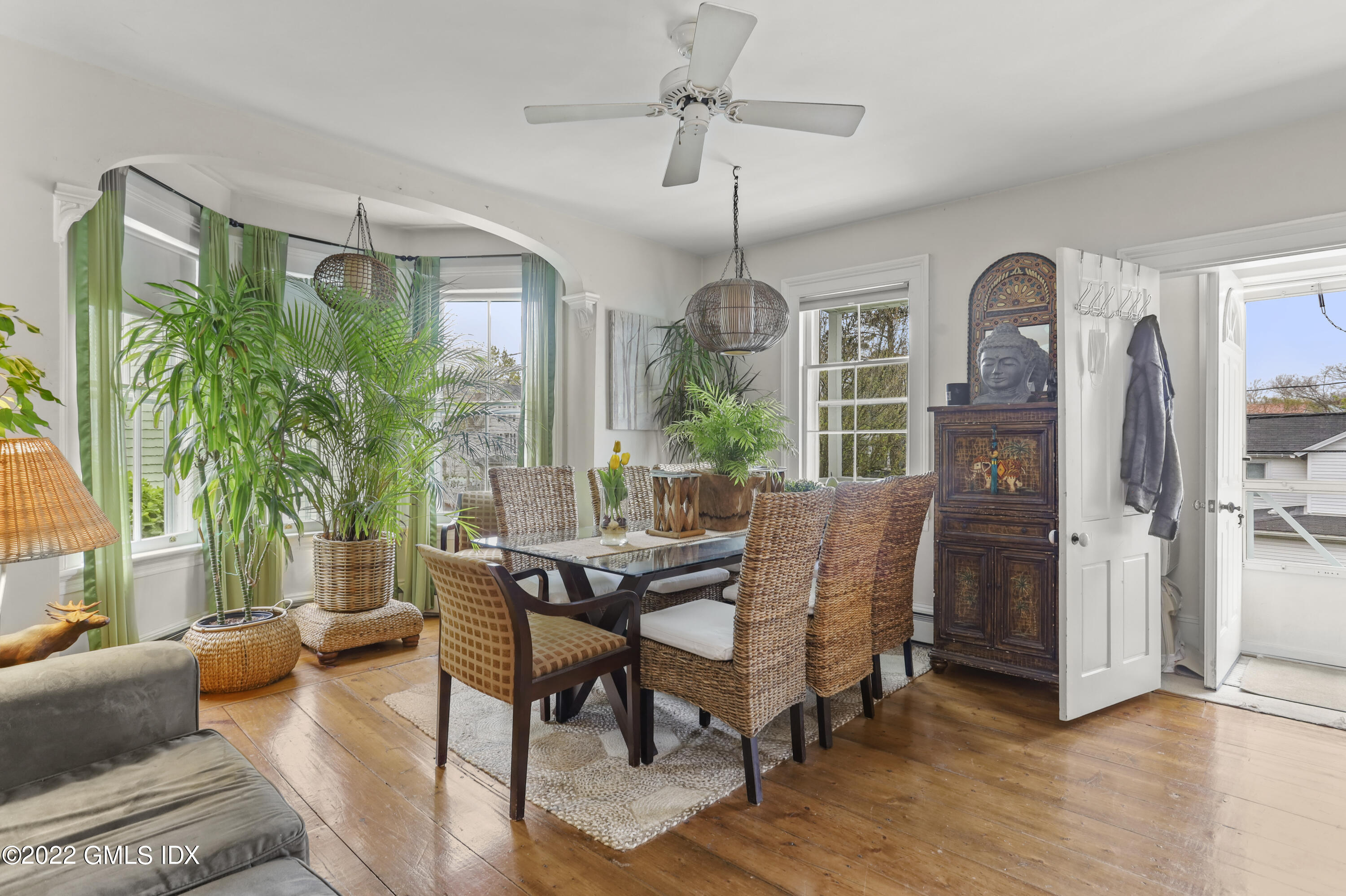 119 North Water Street Greenwich, CT 06830 - Photo 3 of 15 a dining room with furniture a chandelier and wooden floor
