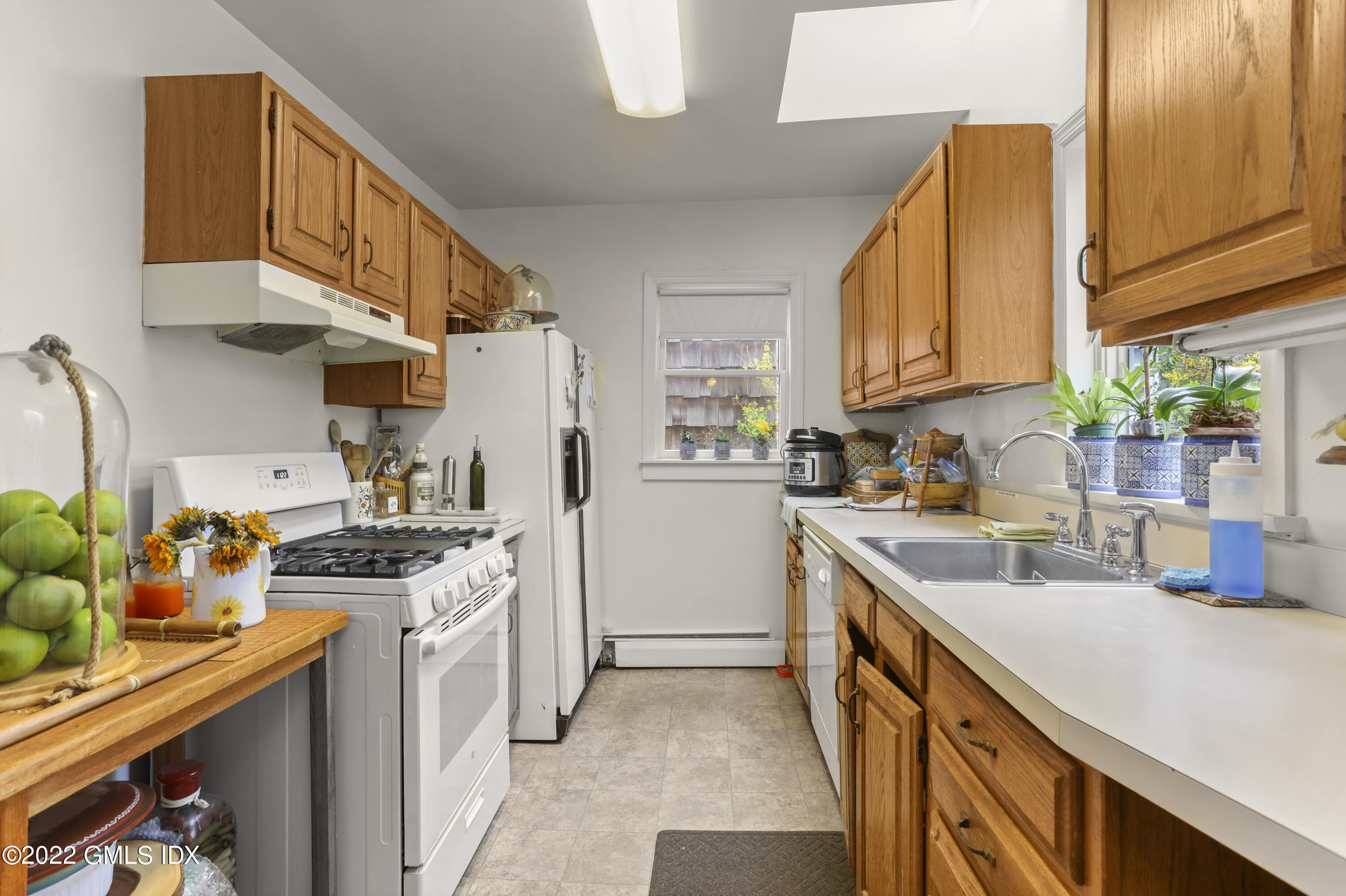 119 North Water Street Greenwich, CT 06830 - Photo 6 of 15 a kitchen with stainless steel appliances granite countertop a sink a stove and a refrigerator