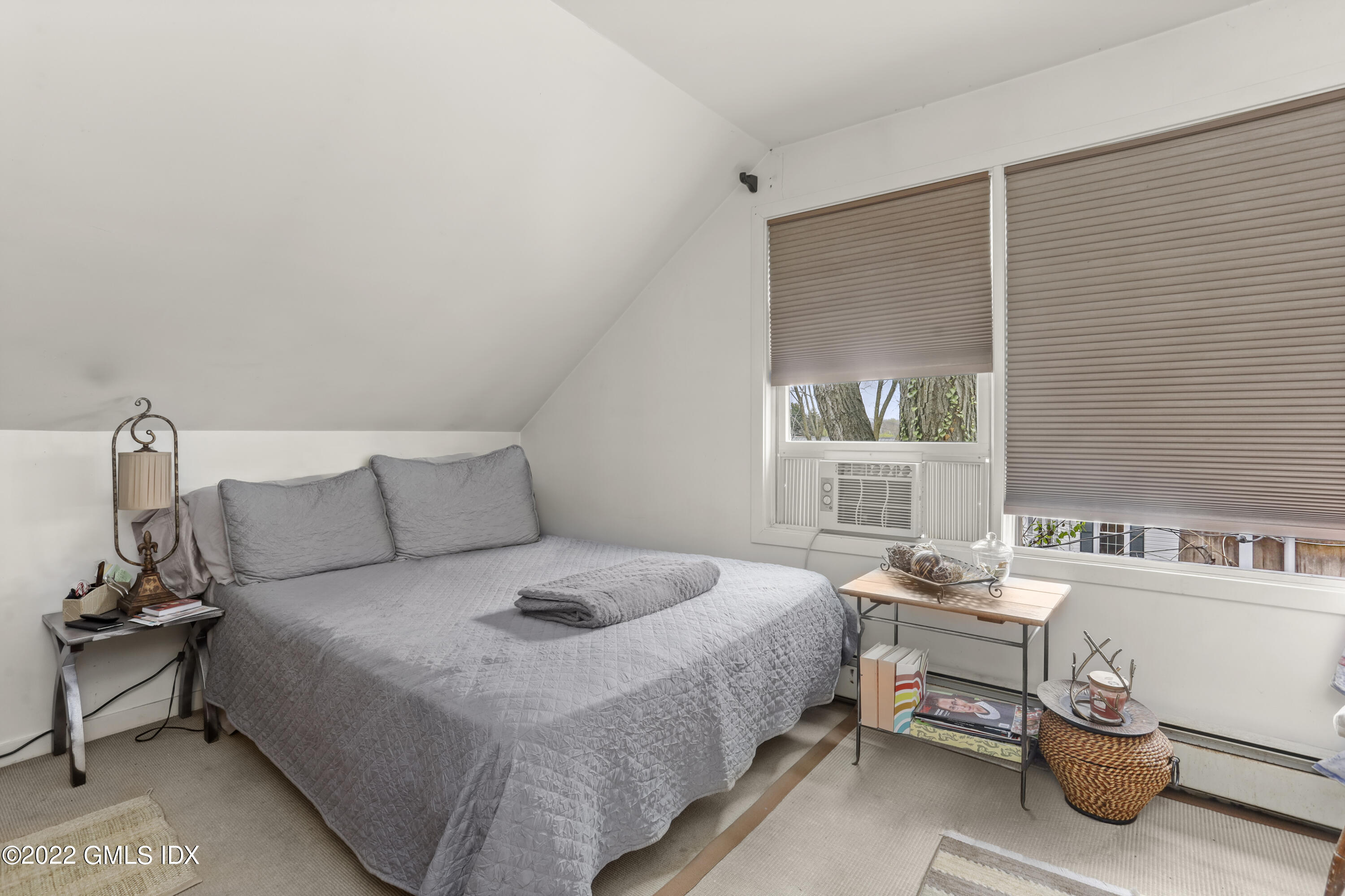 119 North Water Street Greenwich, CT 06830 - Photo 7 of 15 a bedroom with a bed and a window