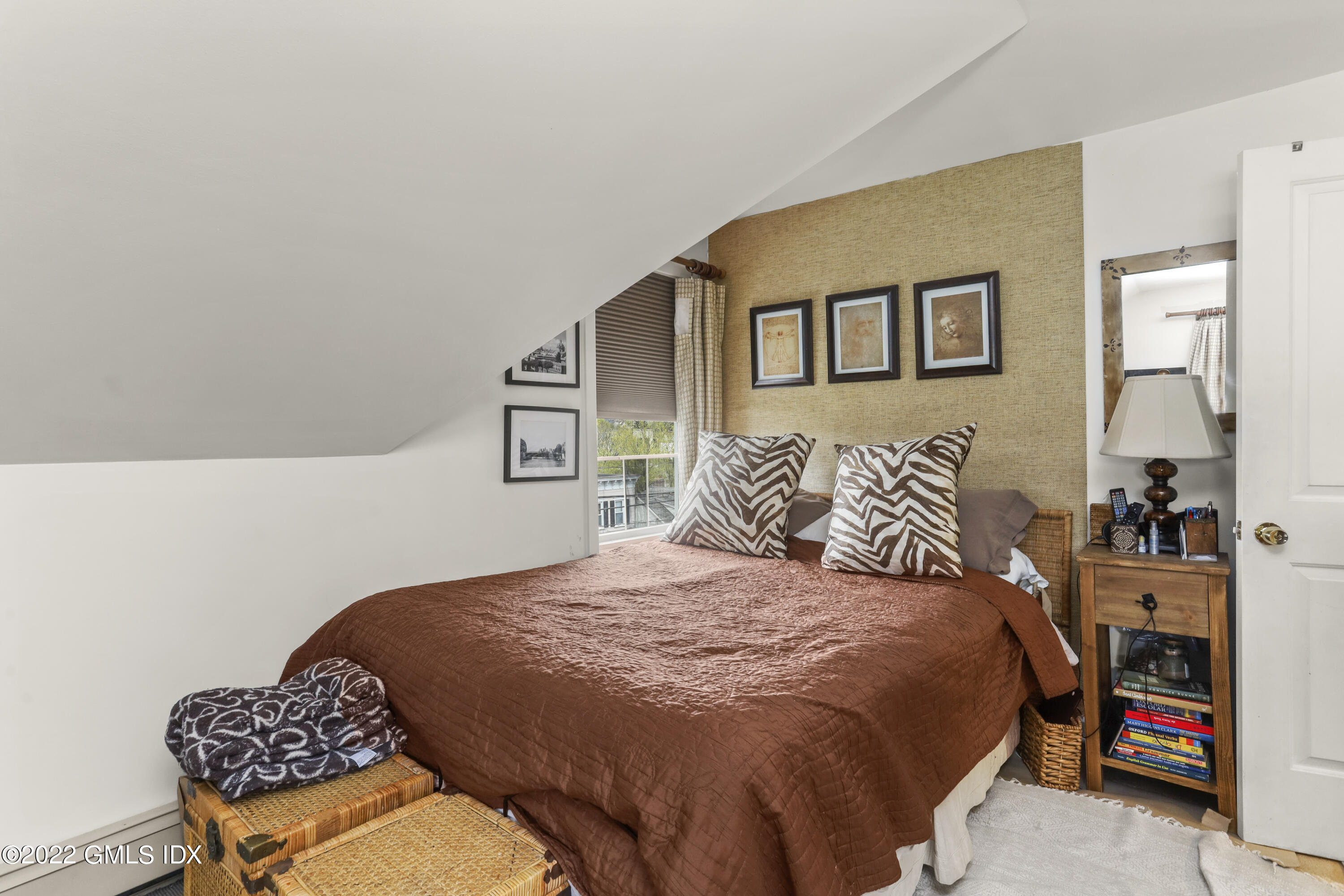 119 North Water Street Greenwich, CT 06830 - Photo 8 of 15 a bedroom with a bed and wooden floor