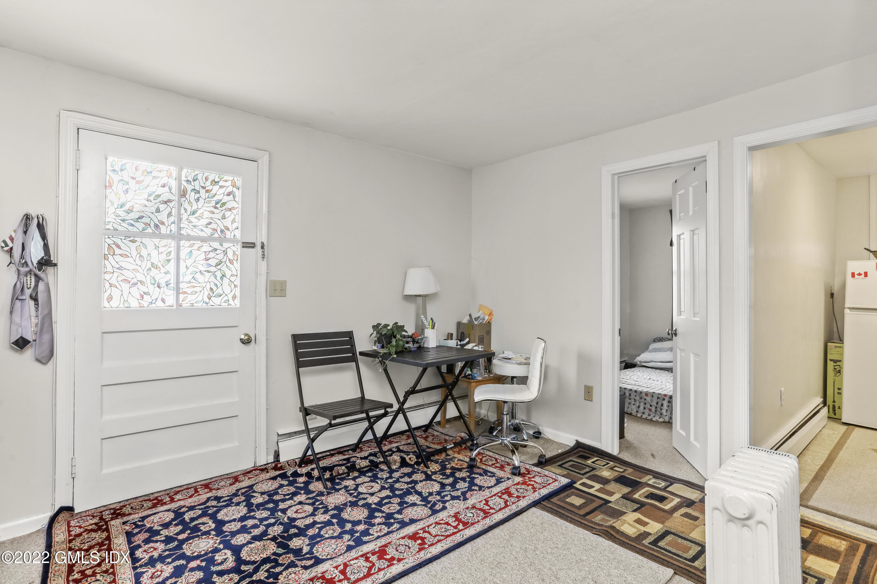 119 North Water Street Greenwich, CT 06830 - Photo 9 of 15 a living room with a rug and a window