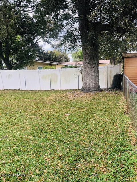 1241 Mardrake Road Daytona Beach, FL 32114 - Photo 30 of 32 WHITE FENCE ON BACK OF PROPERTY