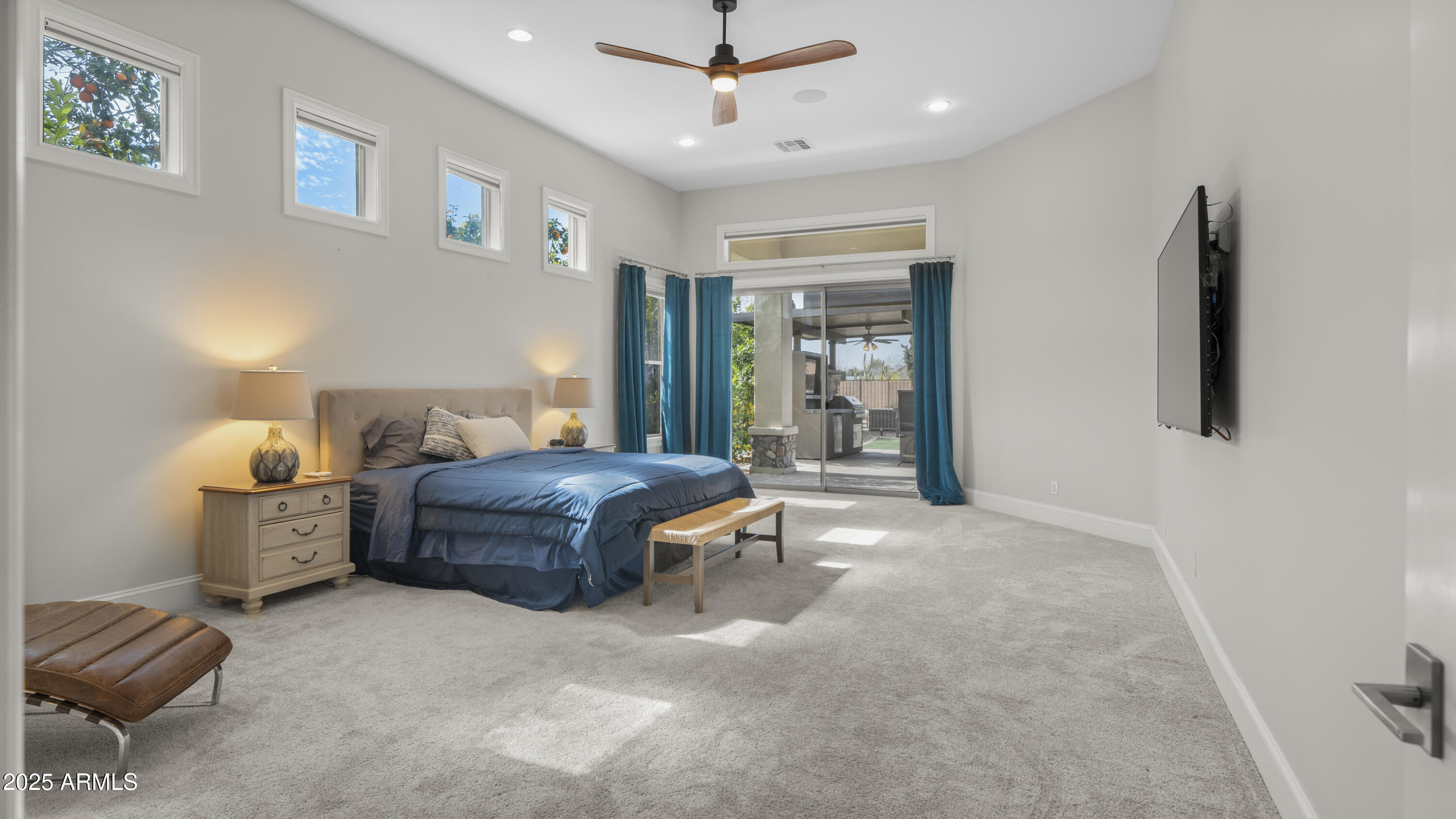 56 South Prairie Road Gilbert, AZ 85296 - Photo 21 of 59 a living room with furniture a ceiling fan and a rug