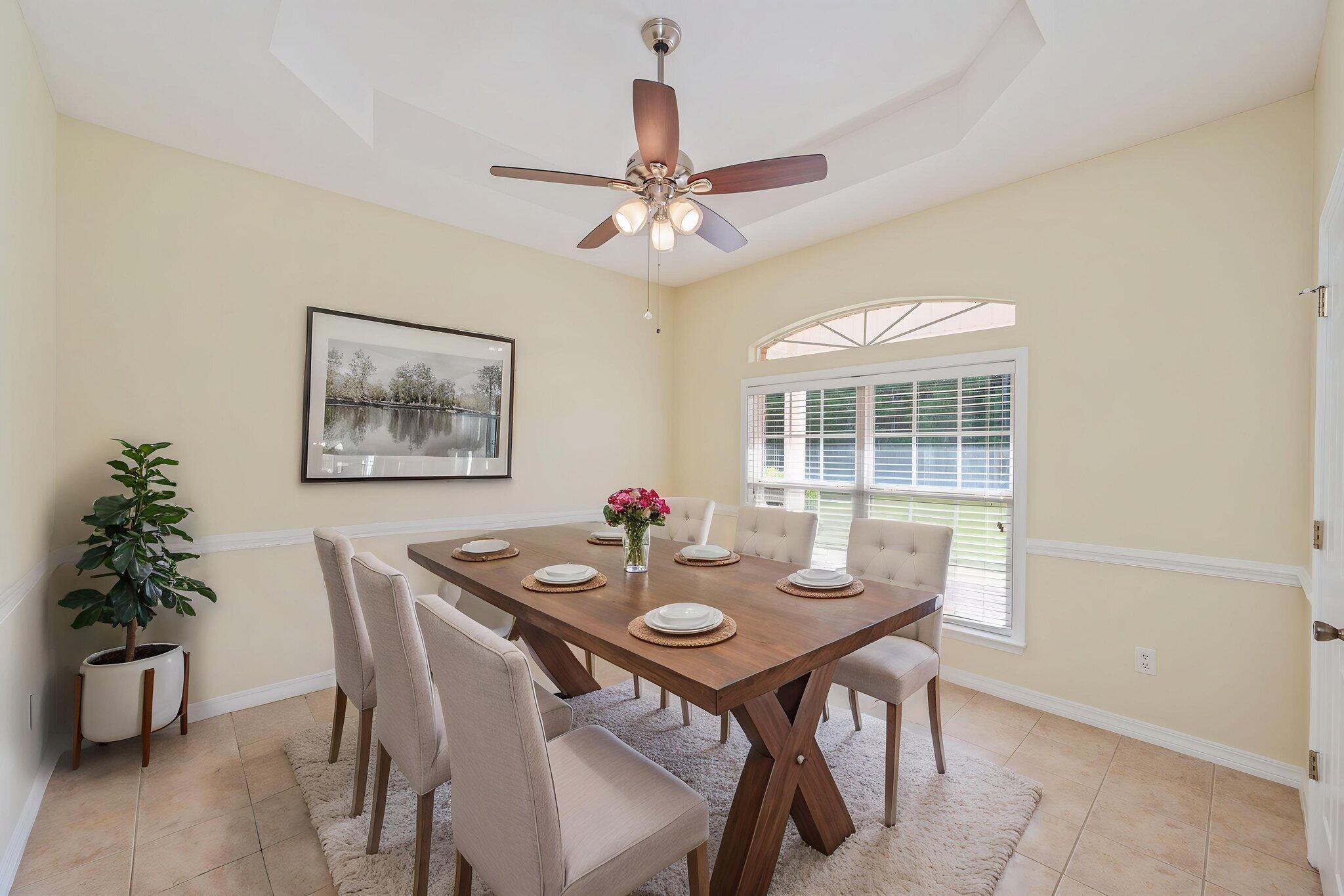5552 Frontier Drive Crestview, FL 32536 - Photo 13 of 50 a view of a dining room with furniture window and wooden floor