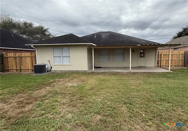 a house with yard in front of it
