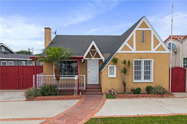 a front view of a house with yard