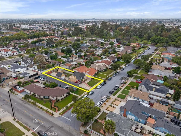 an aerial view of residential houses with outdoor space