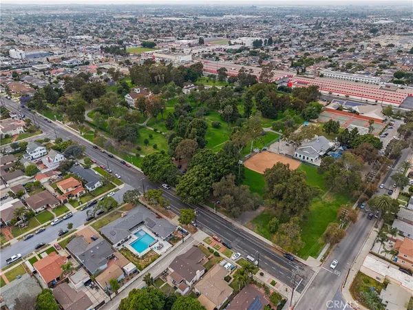 an aerial view of residential houses with outdoor space