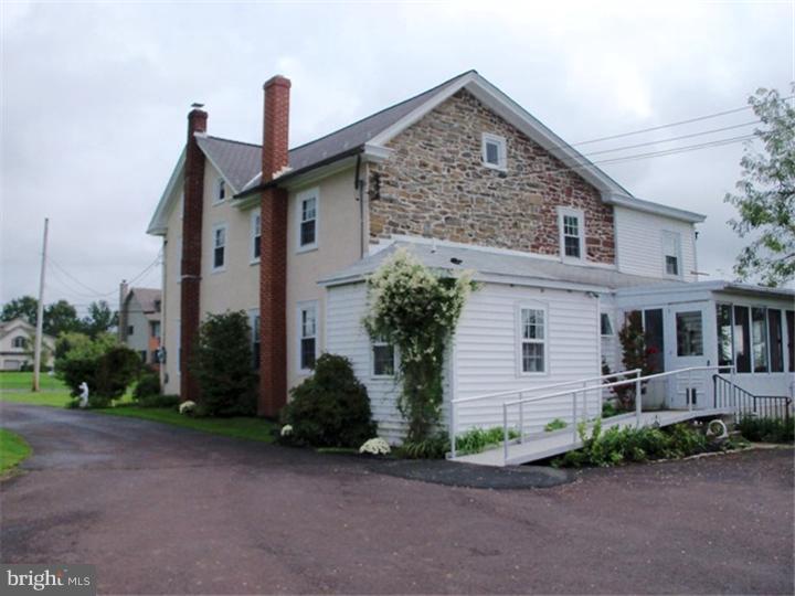 946 Long Mill Road Telford, PA 18969 - Photo 5 of 14 a front view of a house with garden