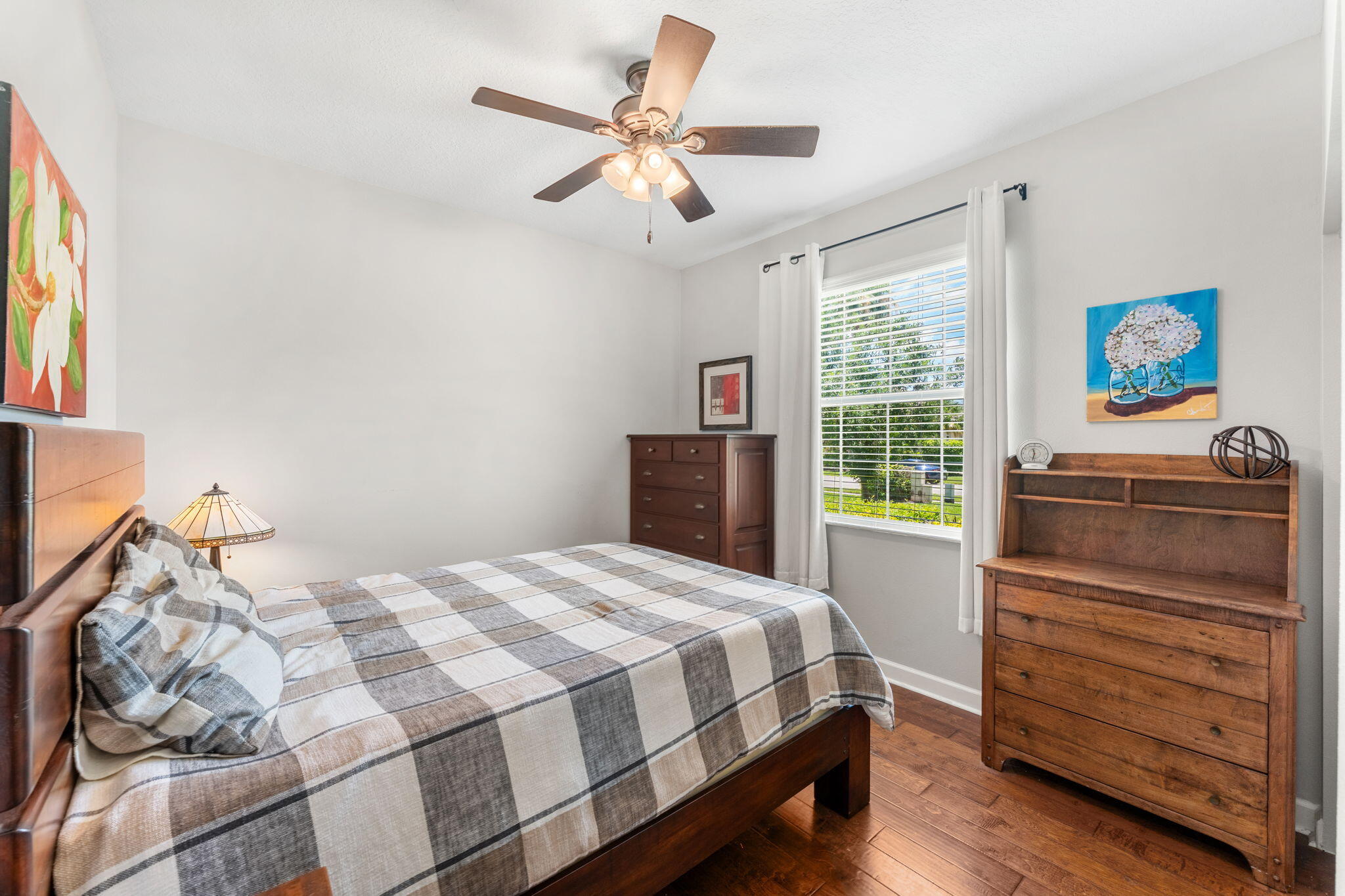 7657 Fieldstone Ranch Square Vero Beach, FL 32967 - Photo 34 of 52 a bedroom with a bed and a dresser