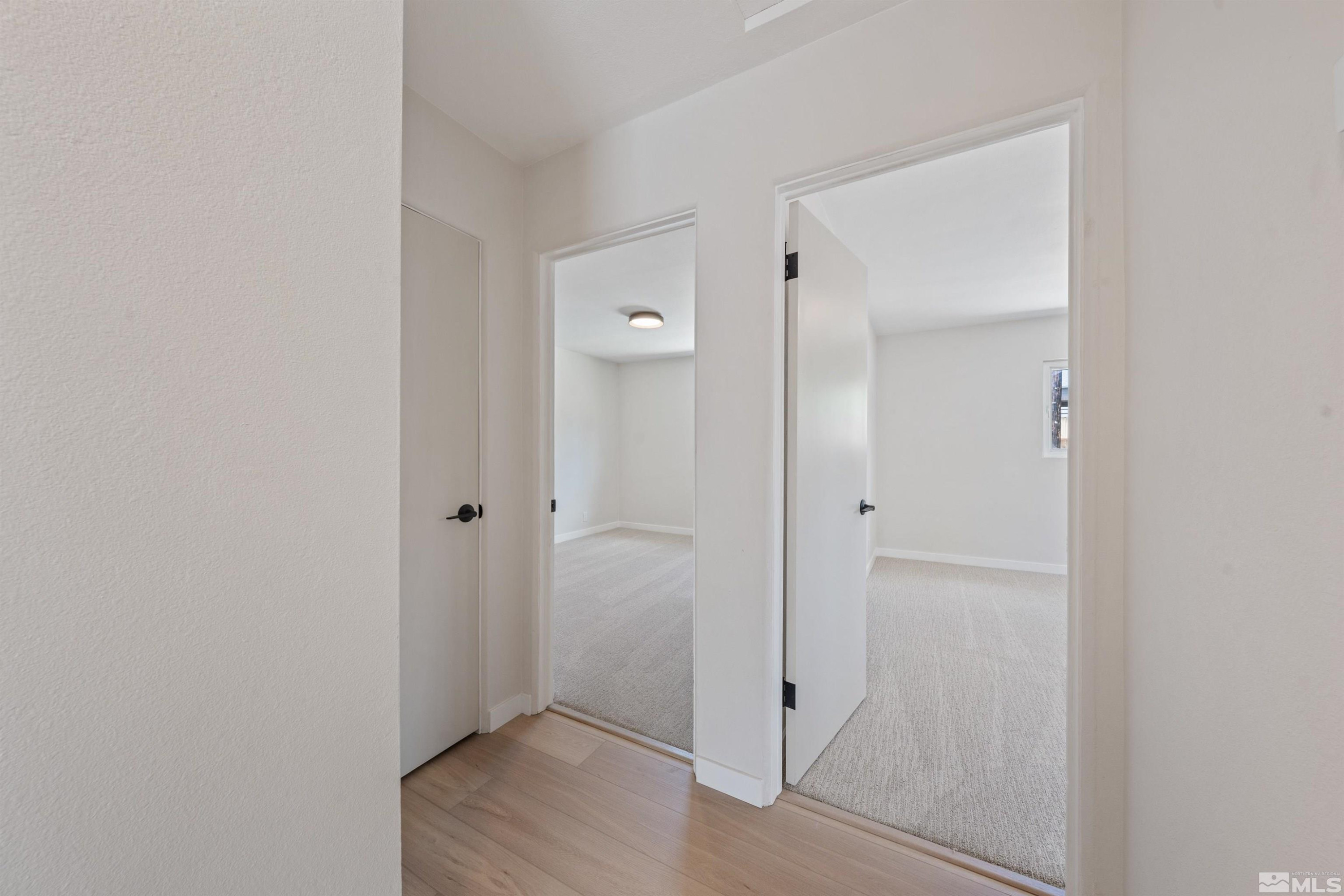 983 Melba Drive Reno, NV 89503 - Photo 21 of 39 a view of room with wooden floor