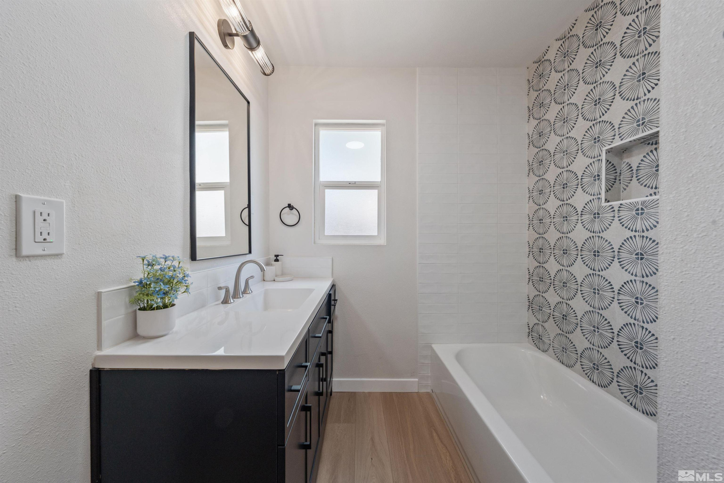 983 Melba Drive Reno, NV 89503 - Photo 23 of 39 a bathroom with a sink and a bathtub