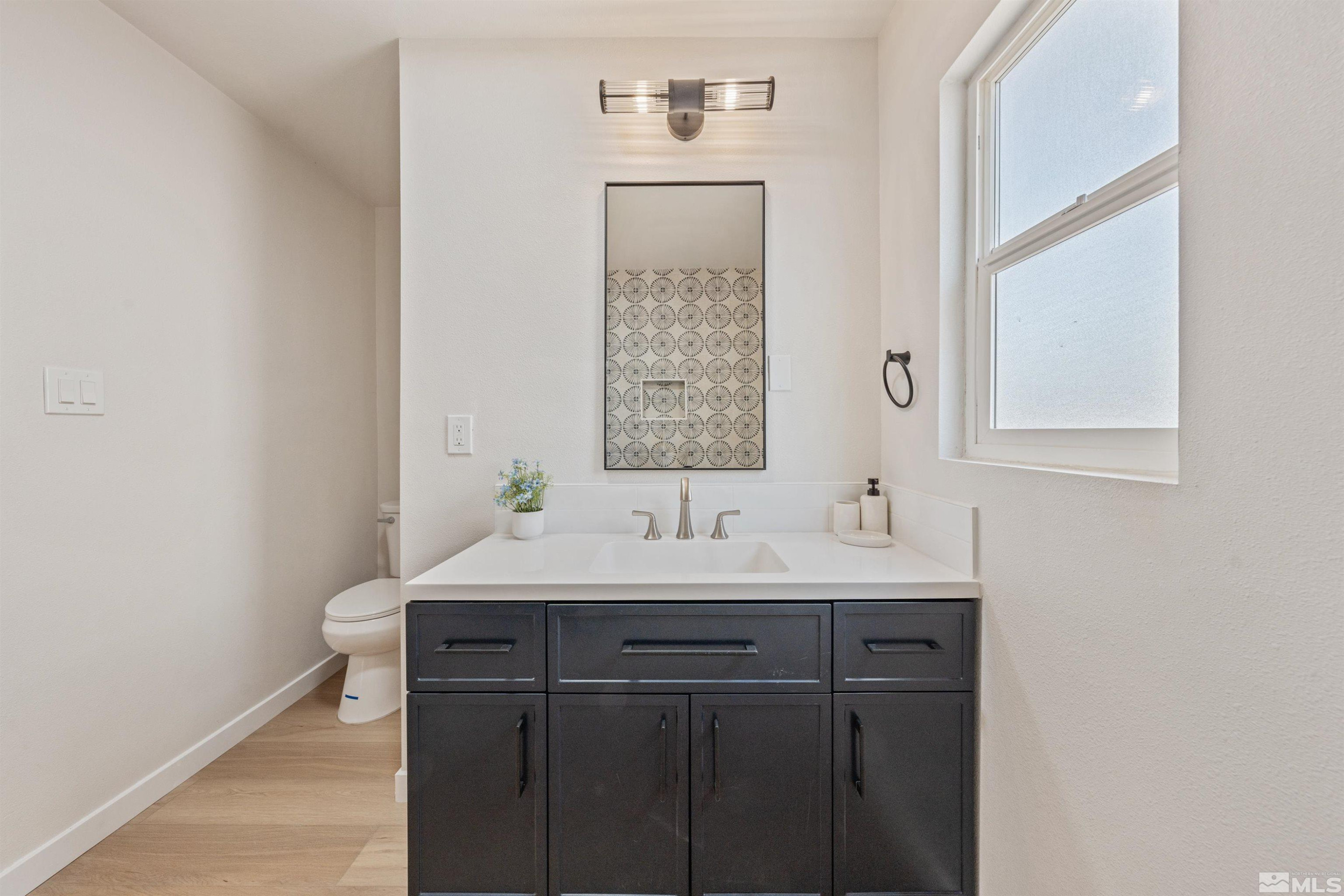 983 Melba Drive Reno, NV 89503 - Photo 24 of 39 a bathroom with a sink and a mirror
