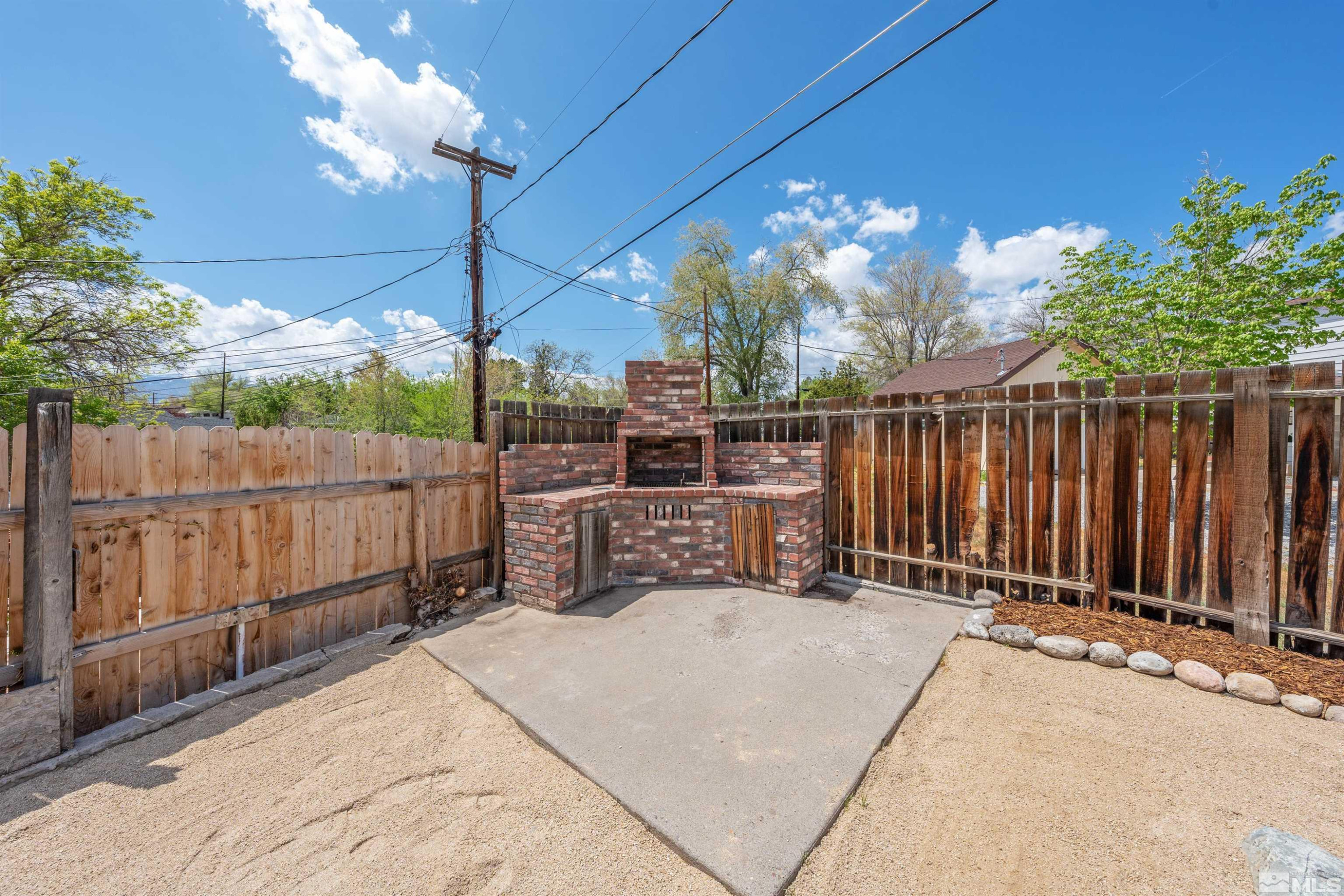 983 Melba Drive Reno, NV 89503 - Photo 31 of 39 a view of a porch with wooden fence